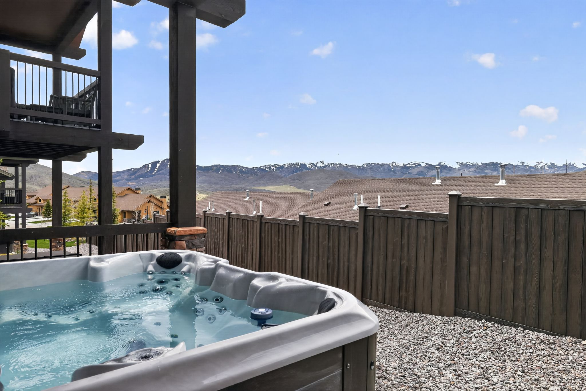 Outdoor spa with integrated jets on a gravel patio