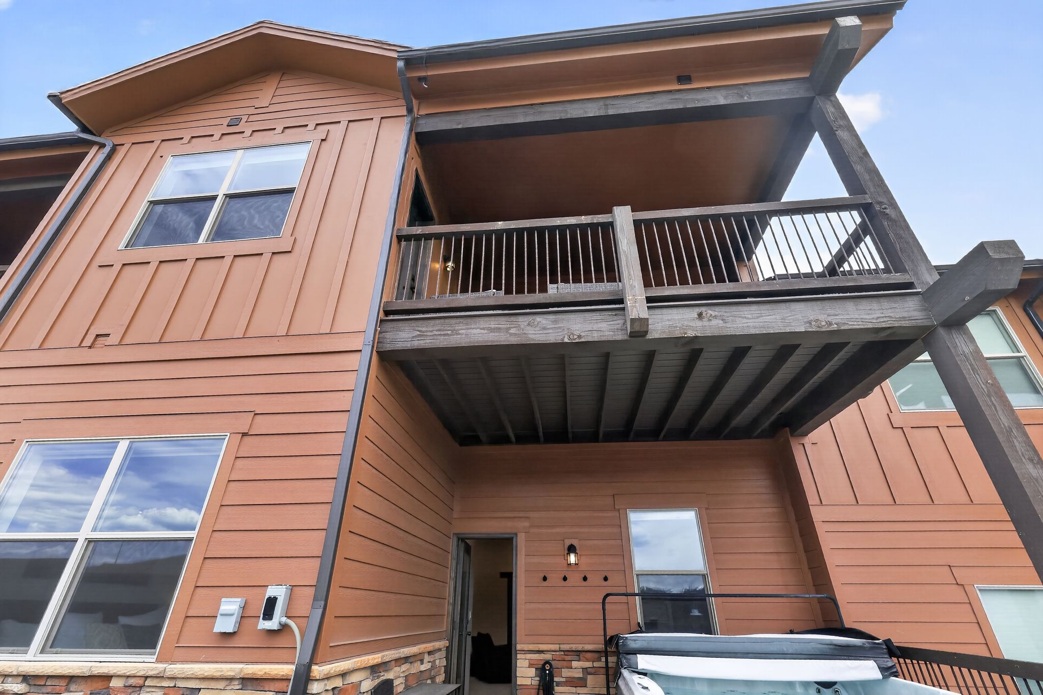 Exterior wood siding and stone veneer accents