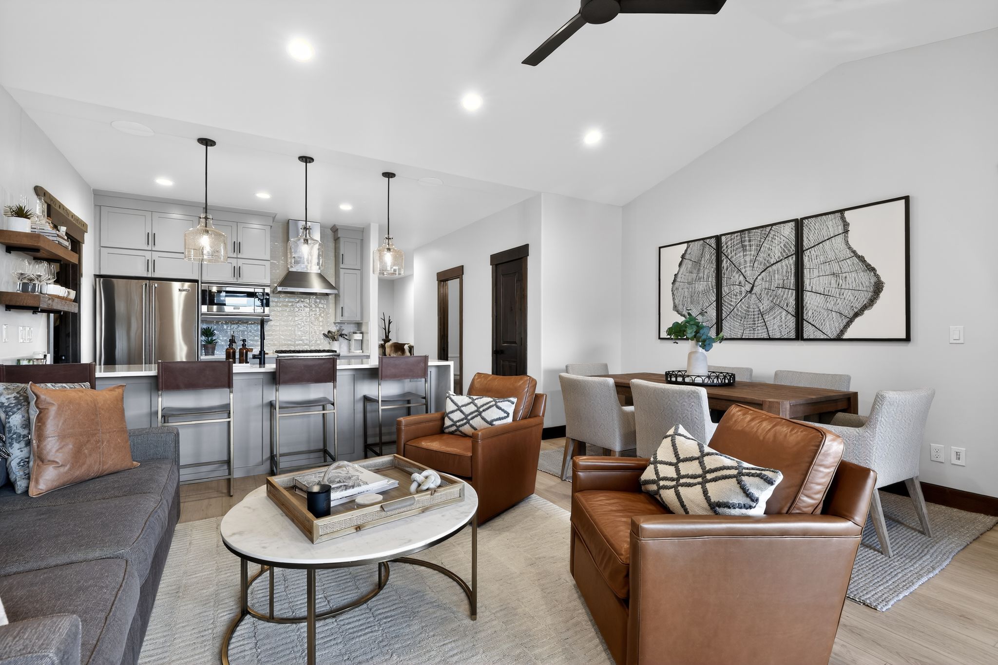 Open-concept living space featuring a vaulted ceiling and recessed lighting