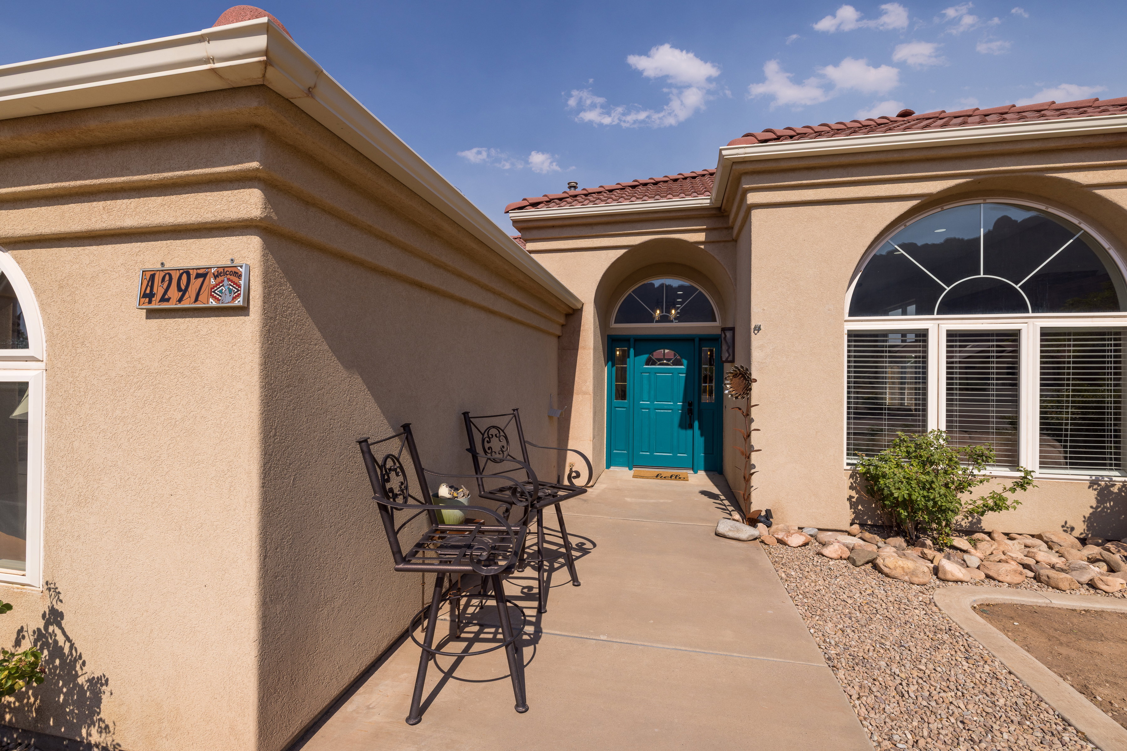 Stucco exterior with a terracotta tile roof