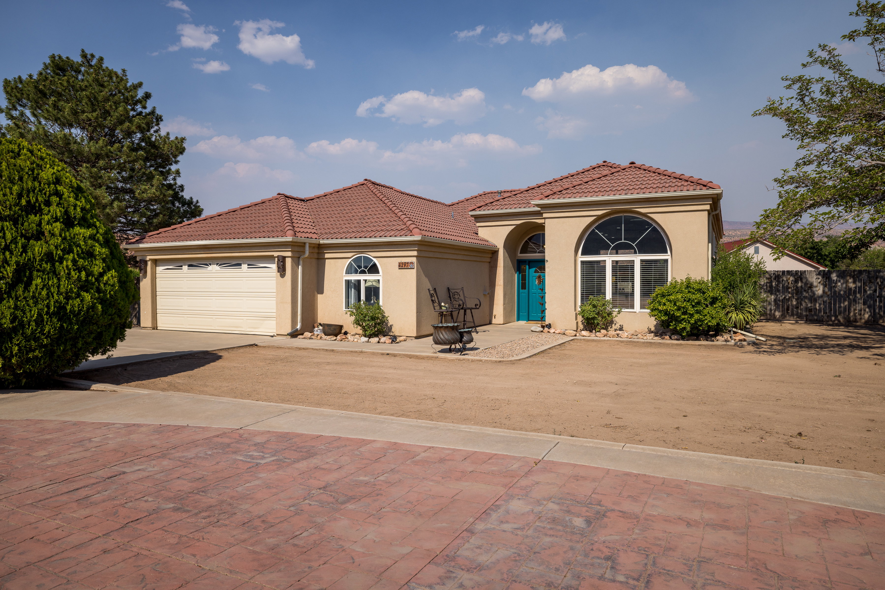 Stucco exterior with a terracotta tile roof