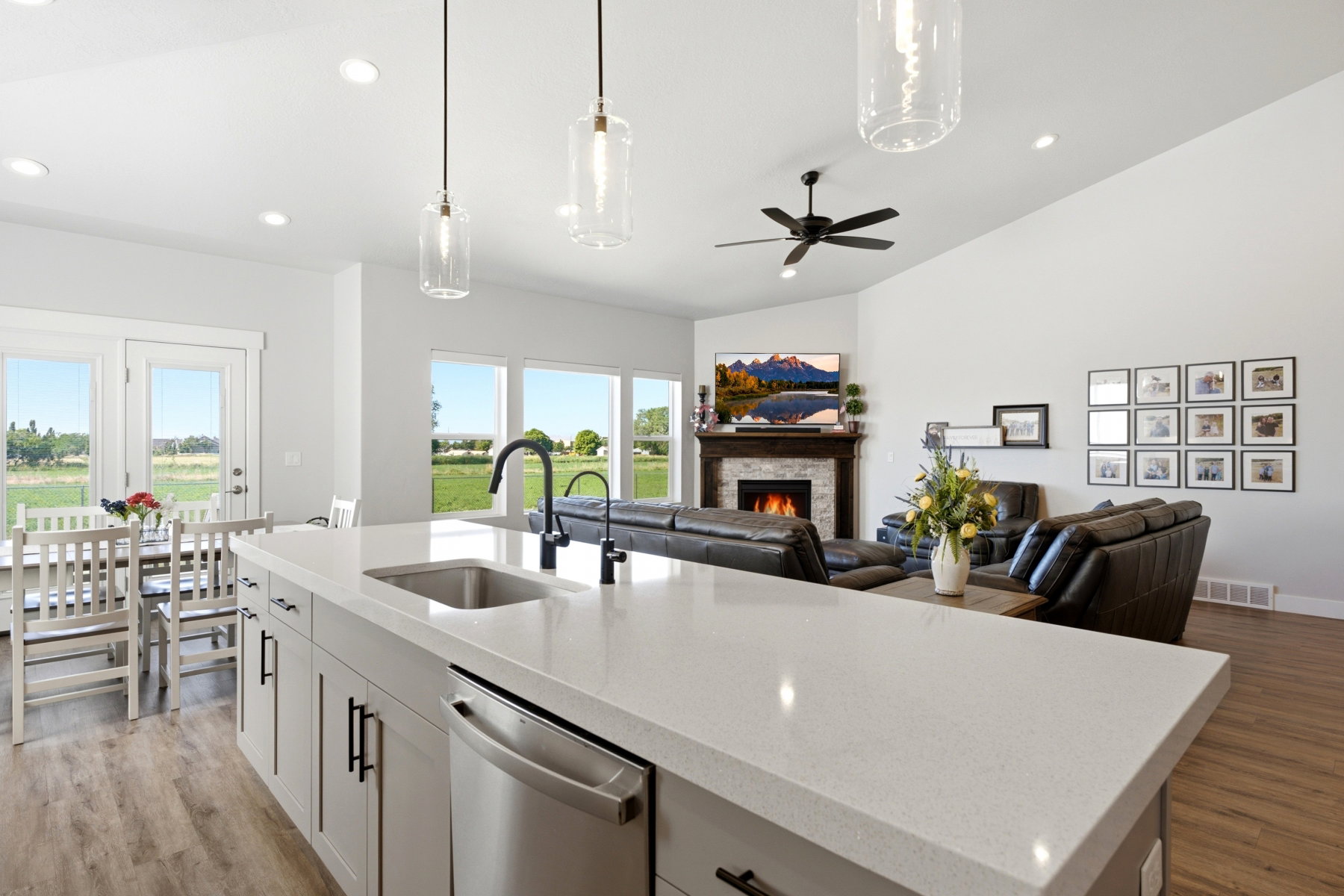 Kitchen with view of dining area and walk-out to the patio