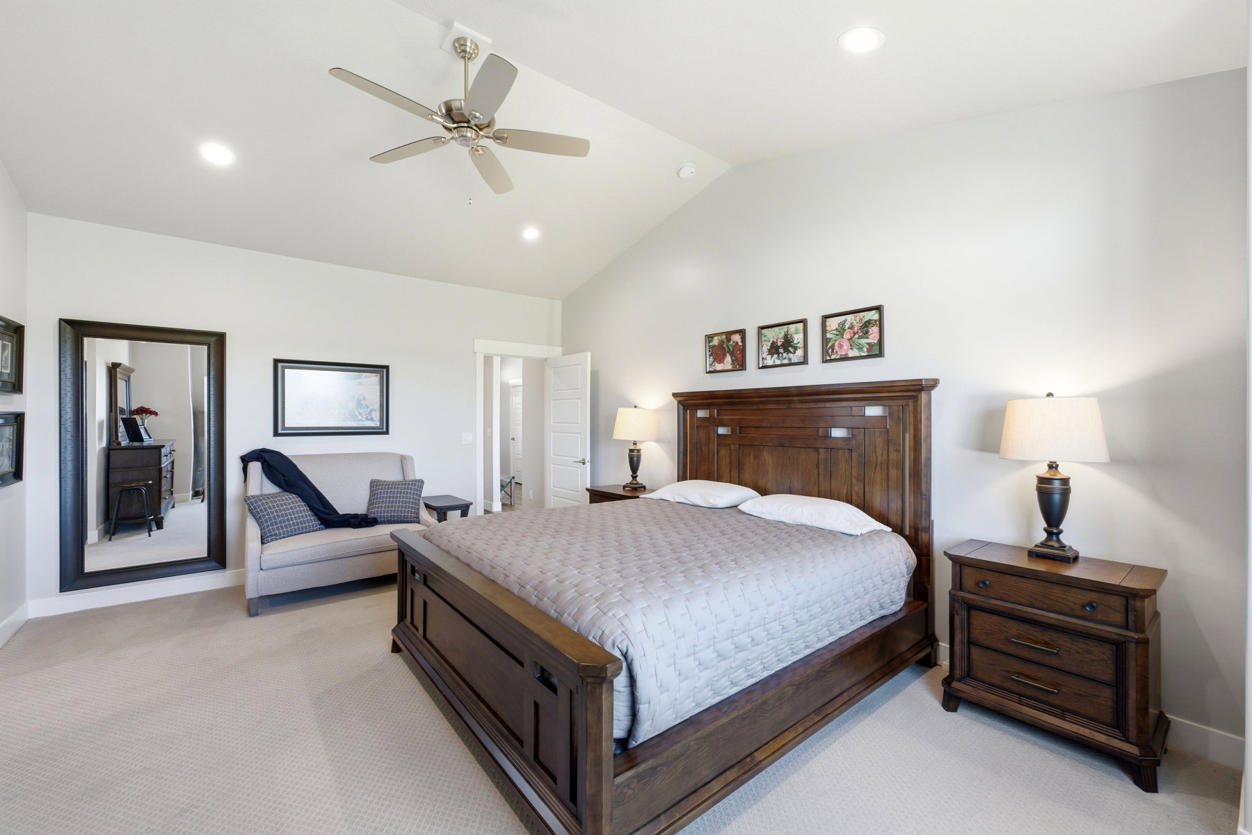 Main level primary bedroom  with vaulted ceilings