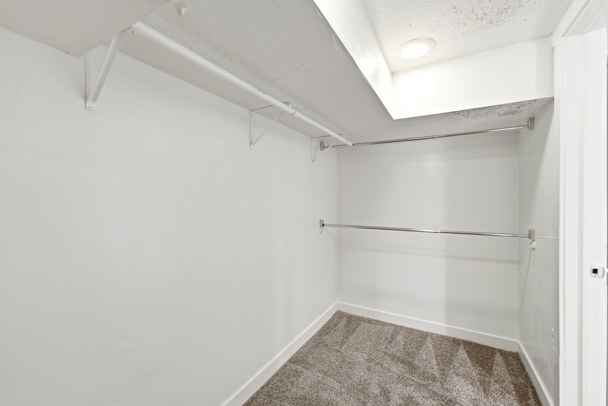 Primary bed walk in closet.