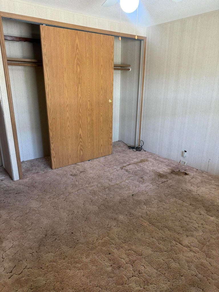 Built-in closet with wood-finish sliding doors