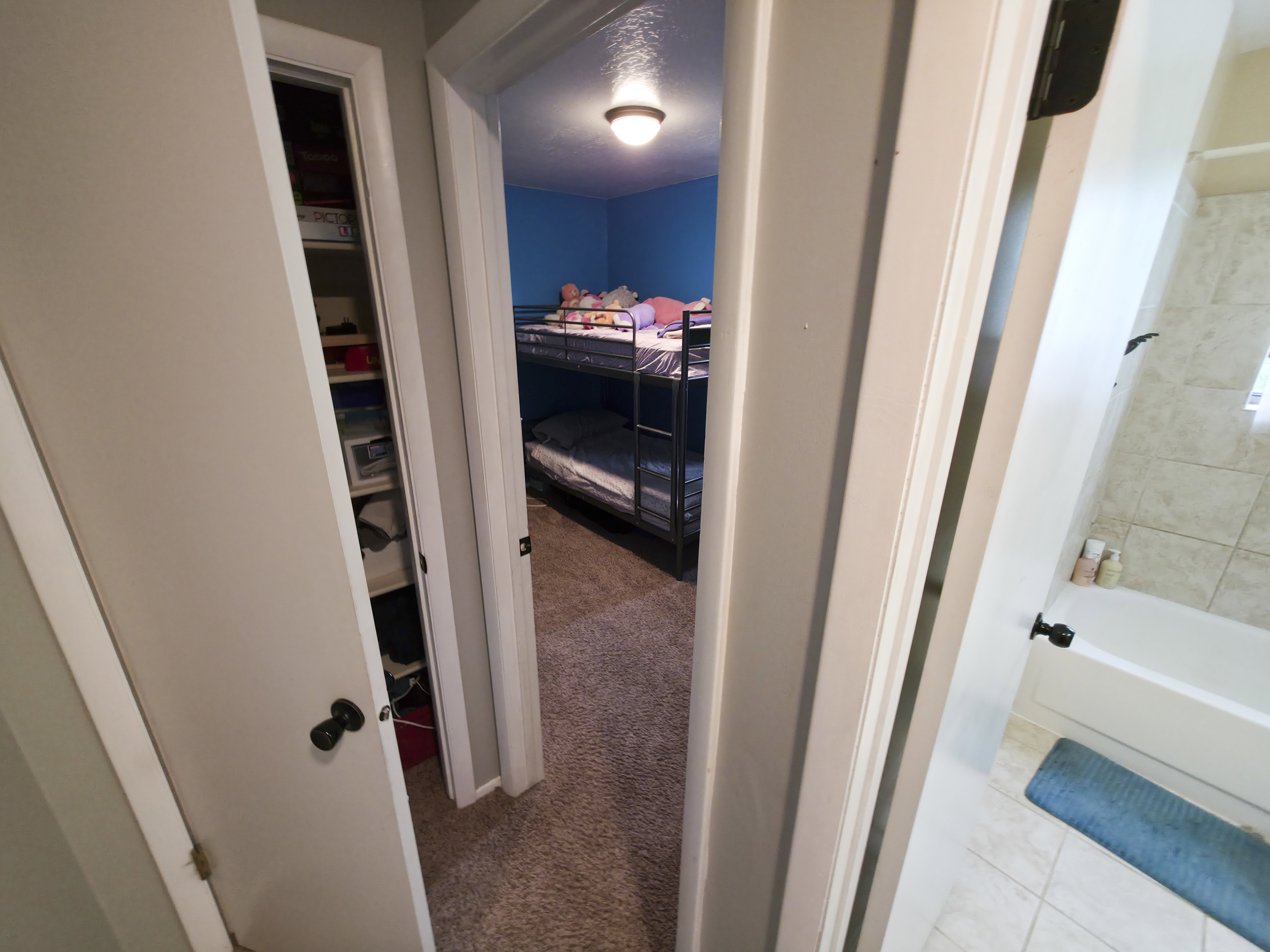 Linen closet on left bedroom 2 at center. Bathroom 1 on right.