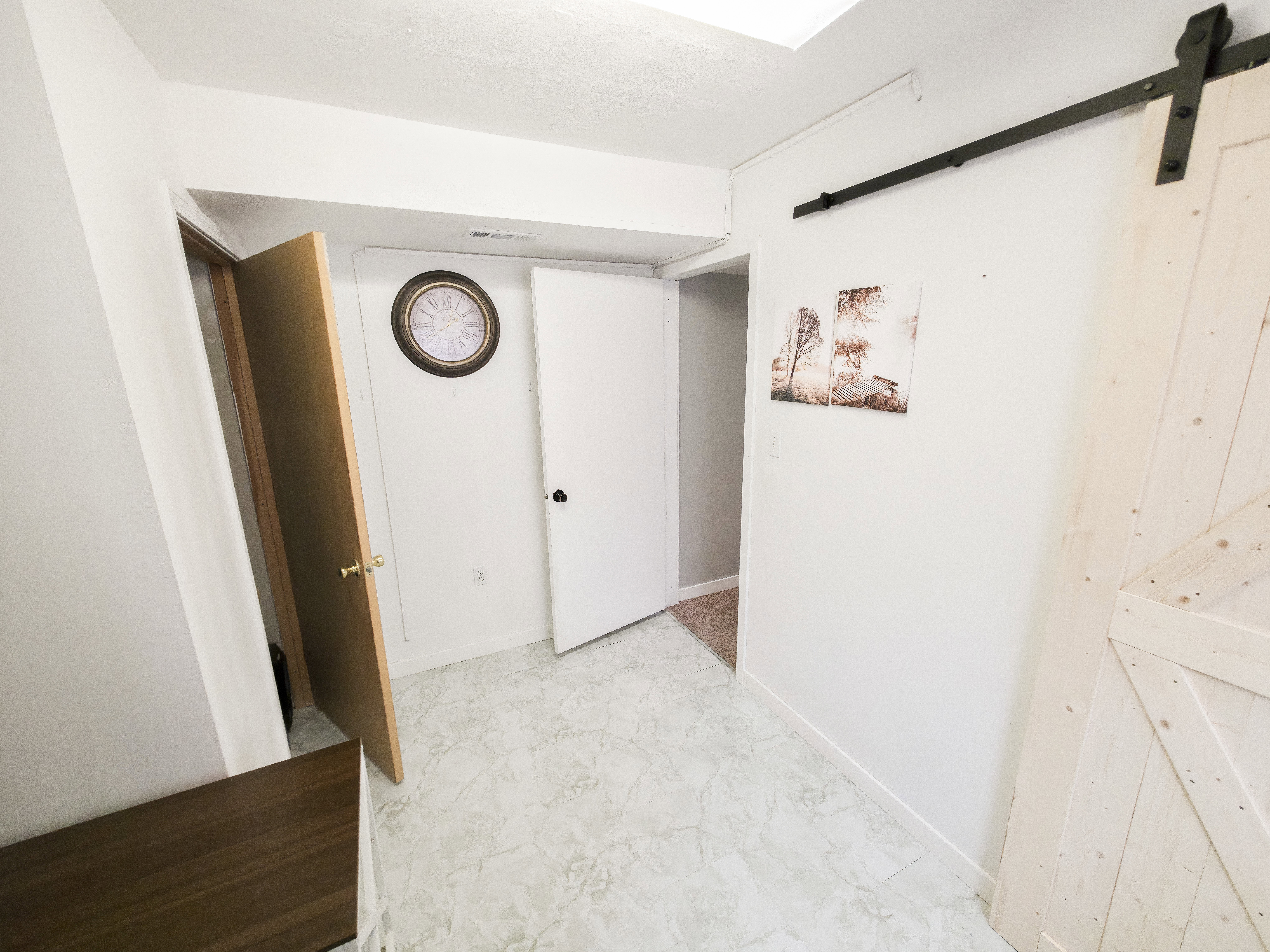 Bedroom 3: closet on left and hallway at center. Laundry/mechanical on right.