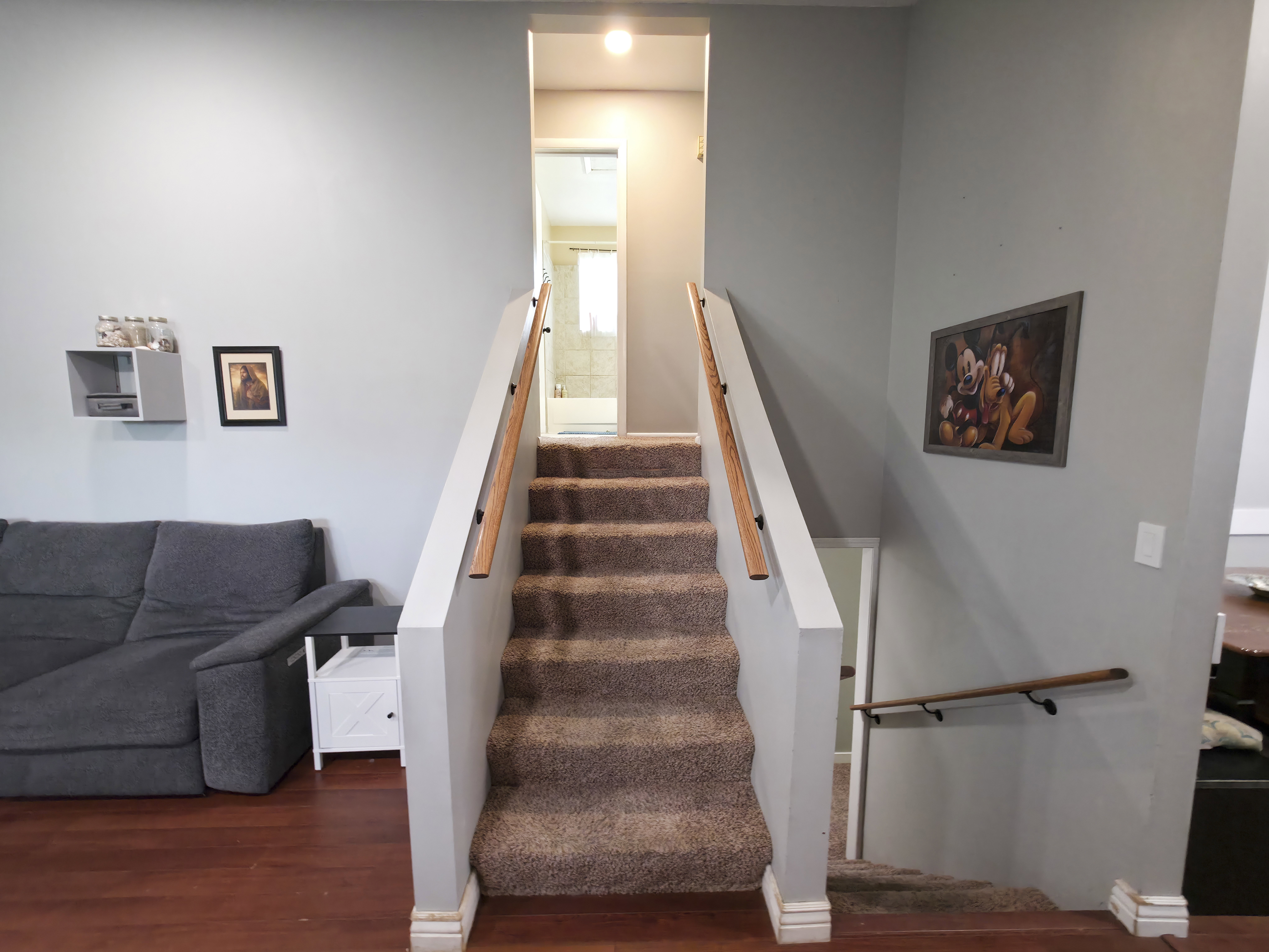 Stairs up to level 2. Bathroom center.