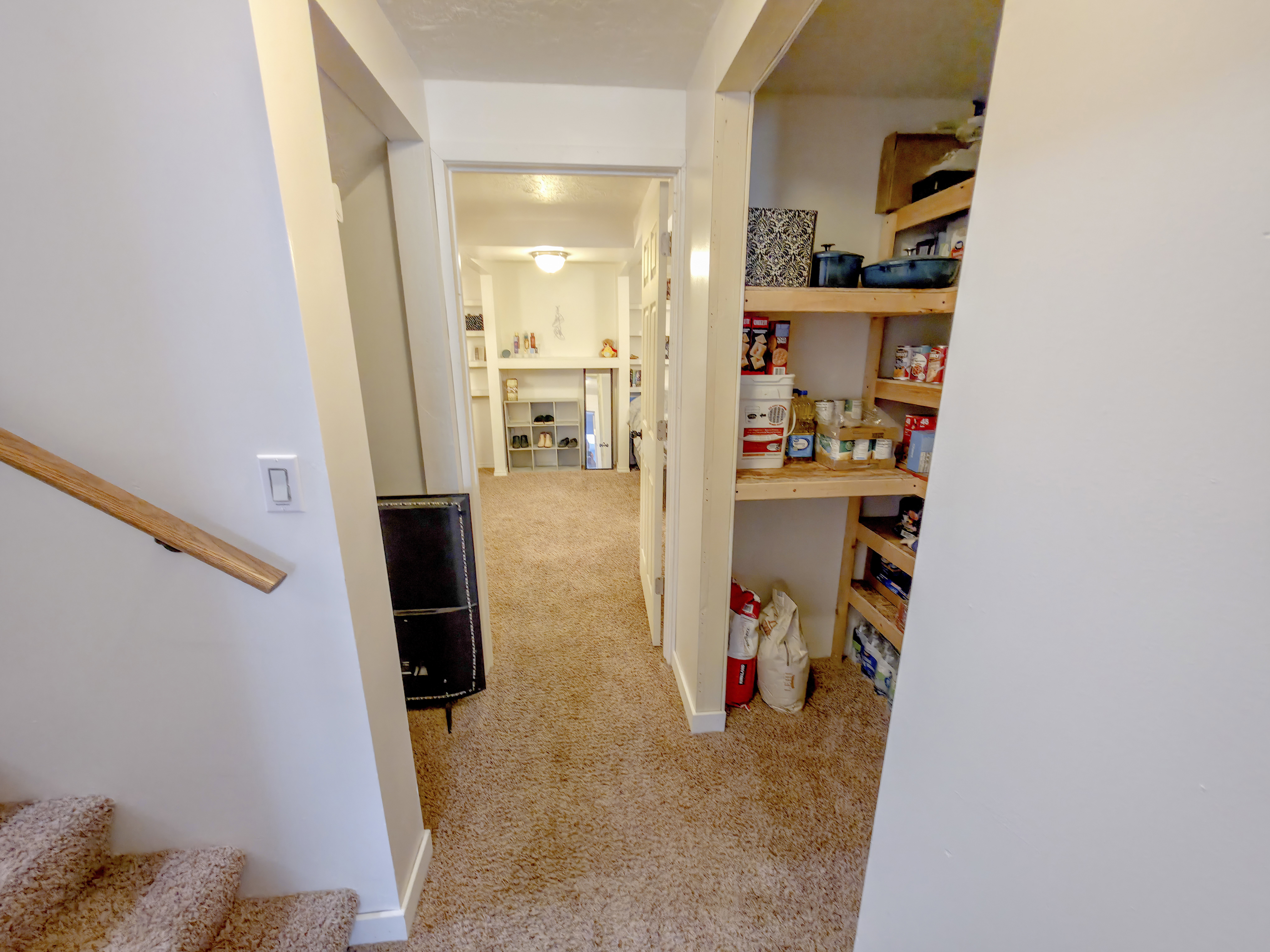 Stairs on left. Then storage. Family room 2 center. Storage on right.