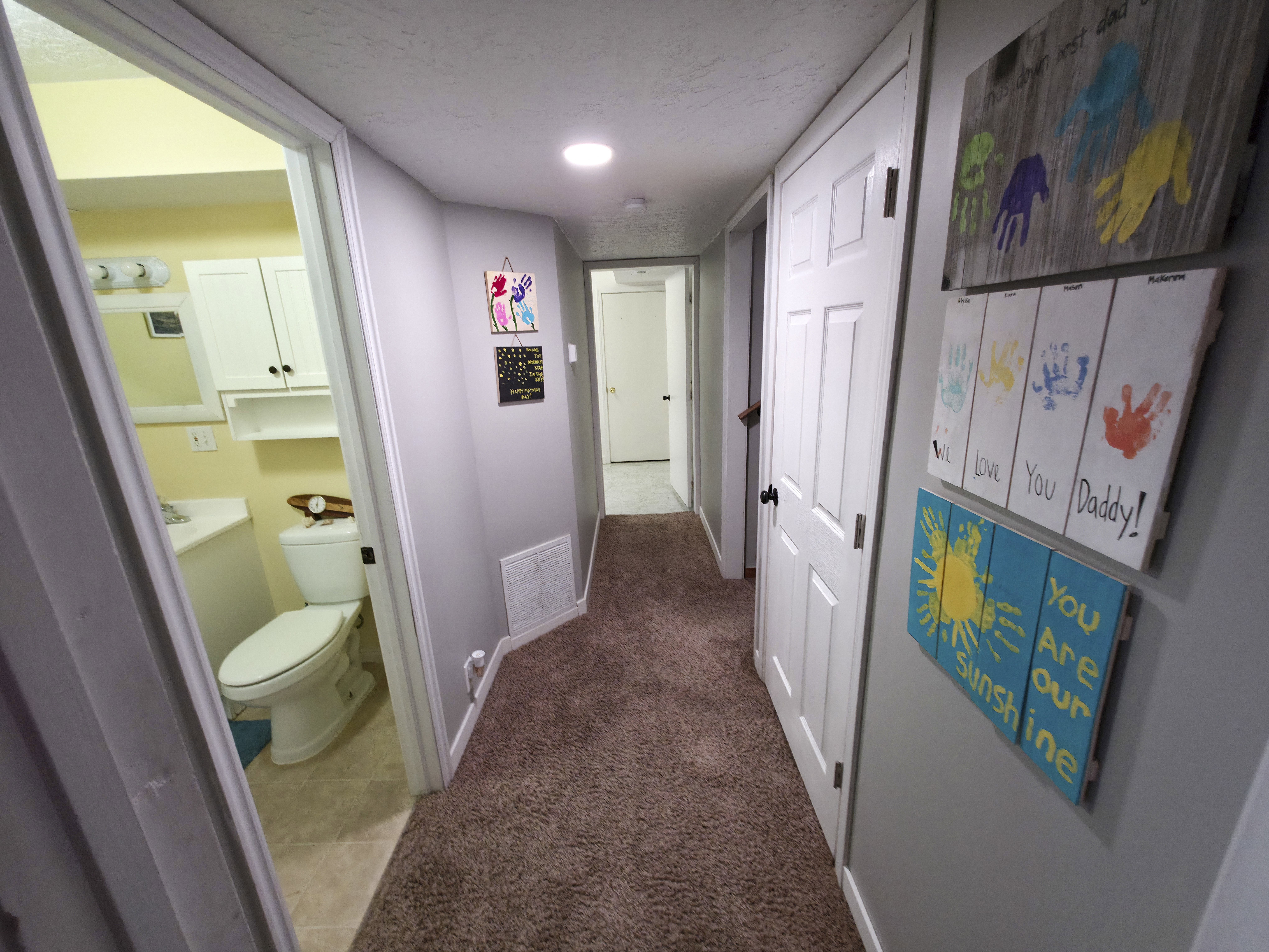 Bathroom 2 at left. Bedroom 3 center. Stairs on right.