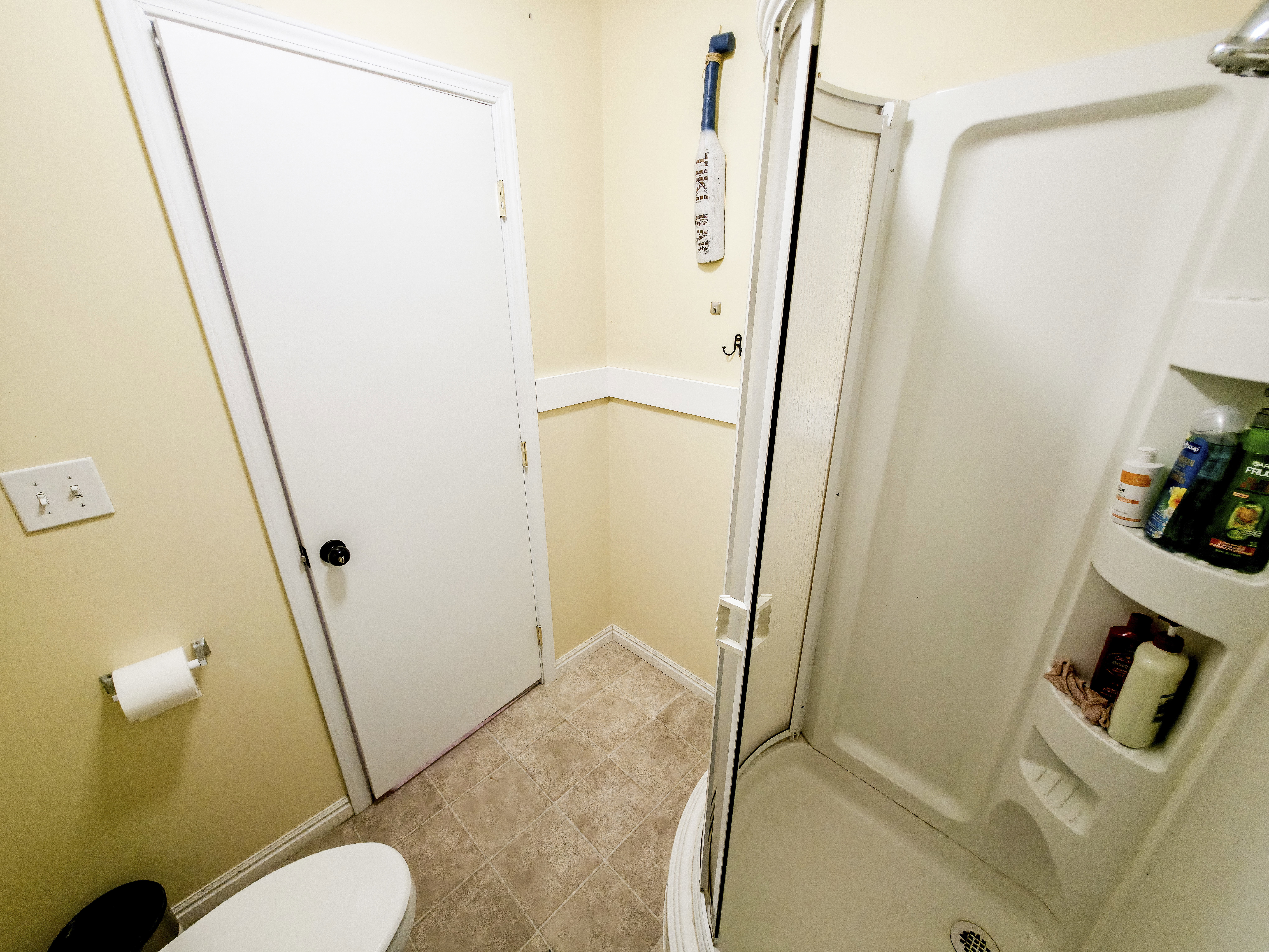 Bathroom 2 with corner shower.