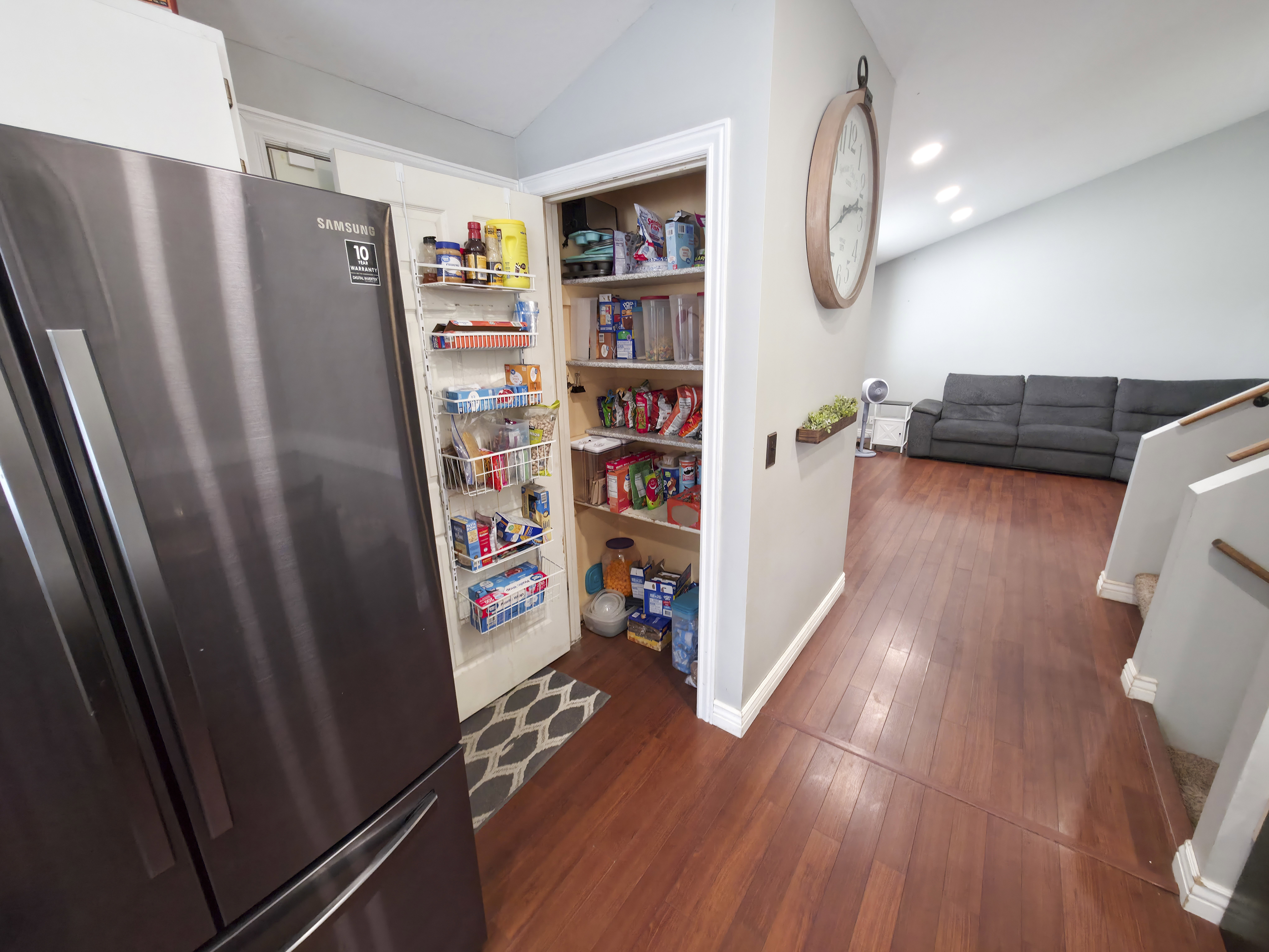 Pantry in kitchen. Stairs on right.