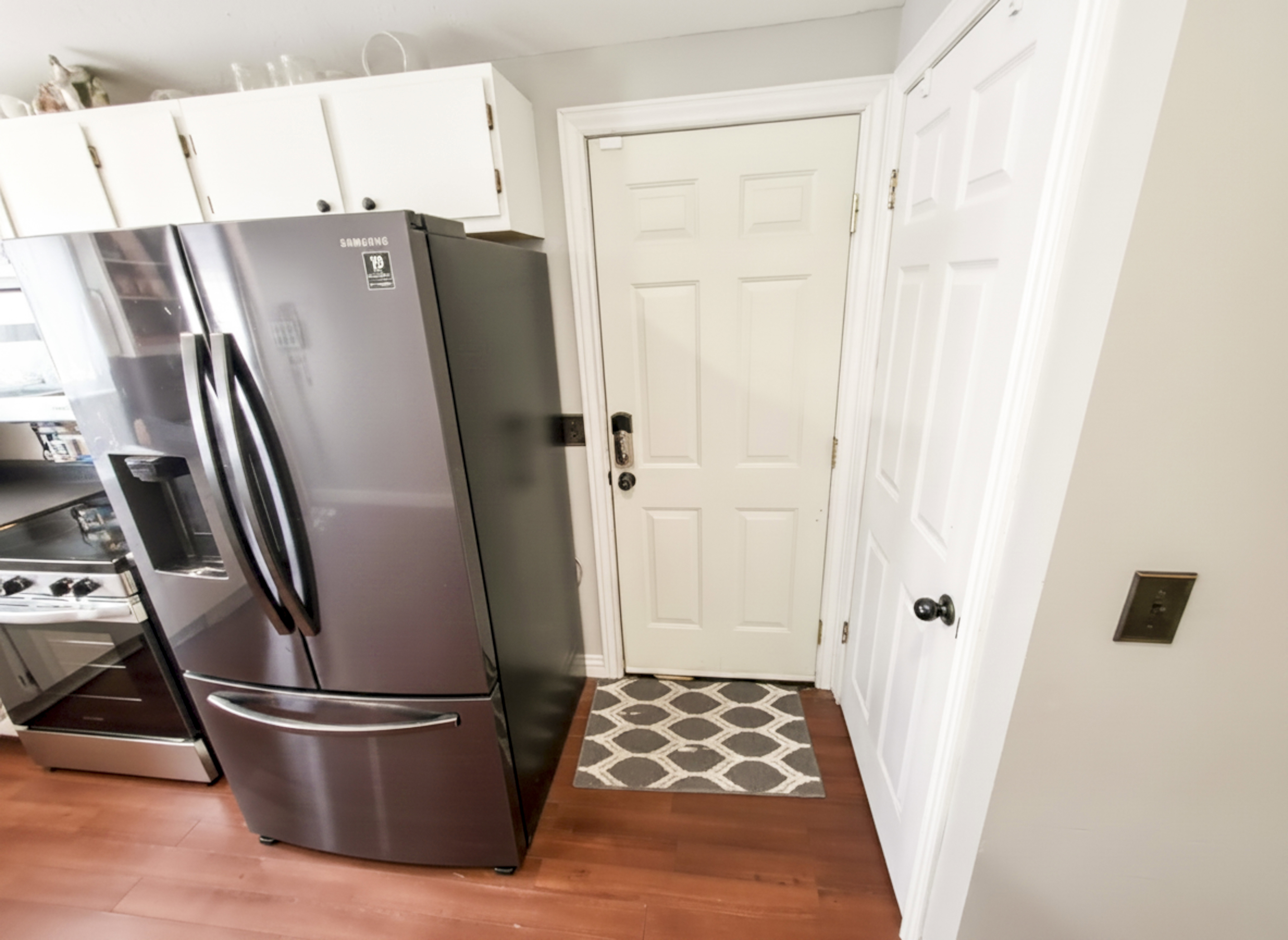 Attached garage entry from kitchen at center.