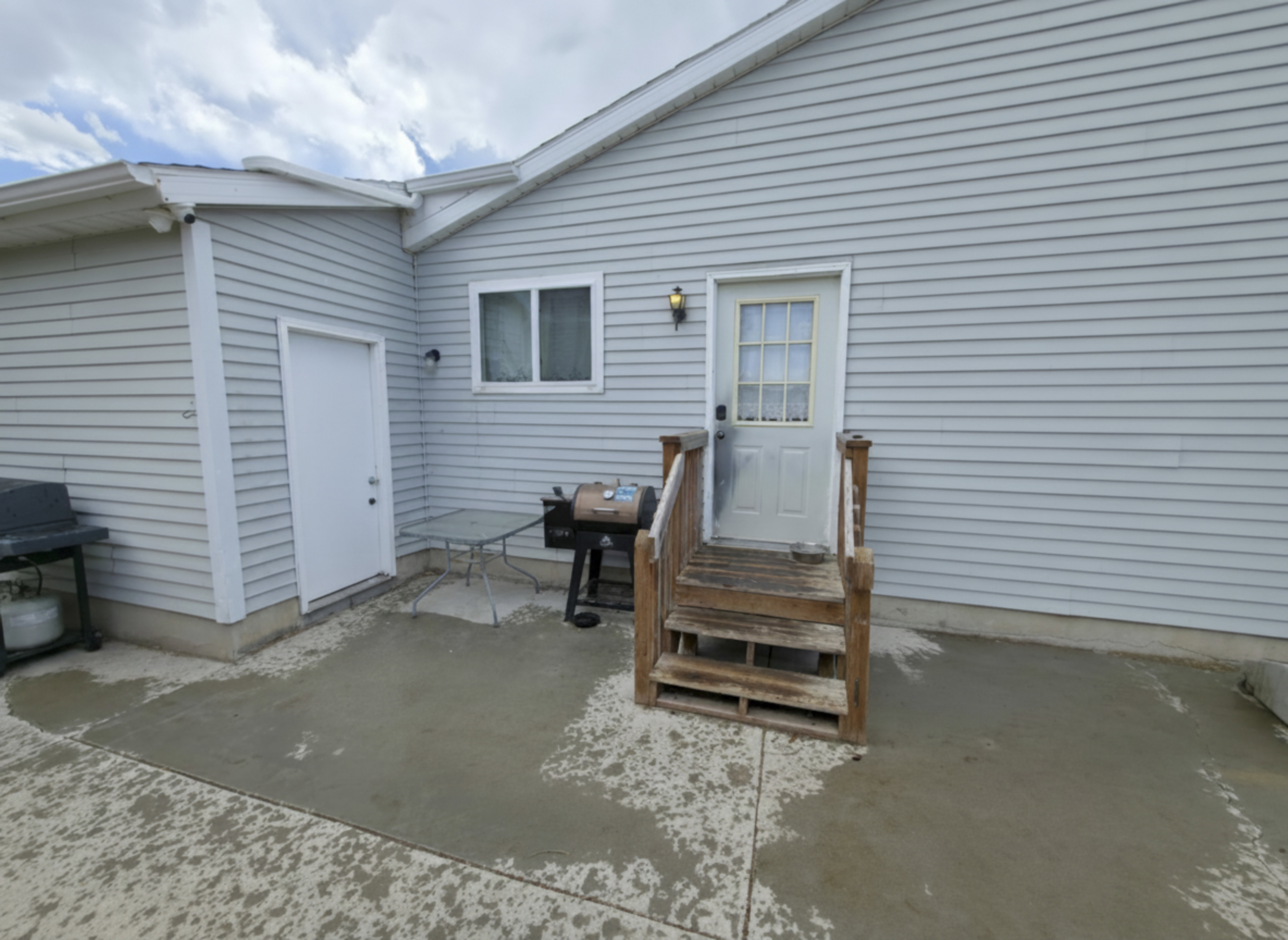 Man door to garage on left. Kitchen entry center.