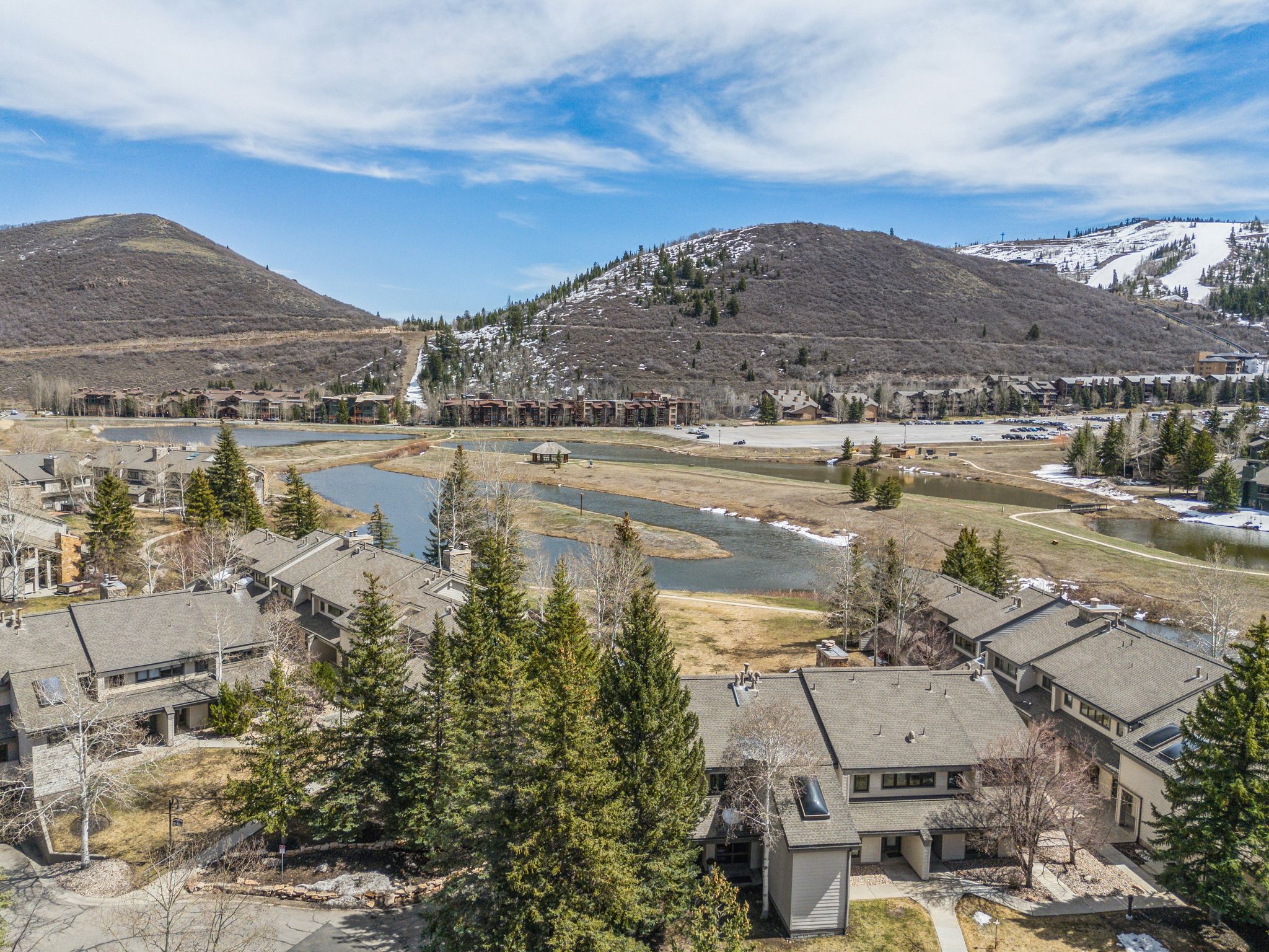 Expansive mountain landscape with a ski resort backdrop