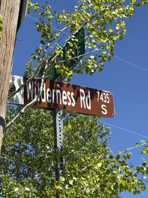 CLOSE UP OF THE SIGNPOST where to turn or walk to the cabin