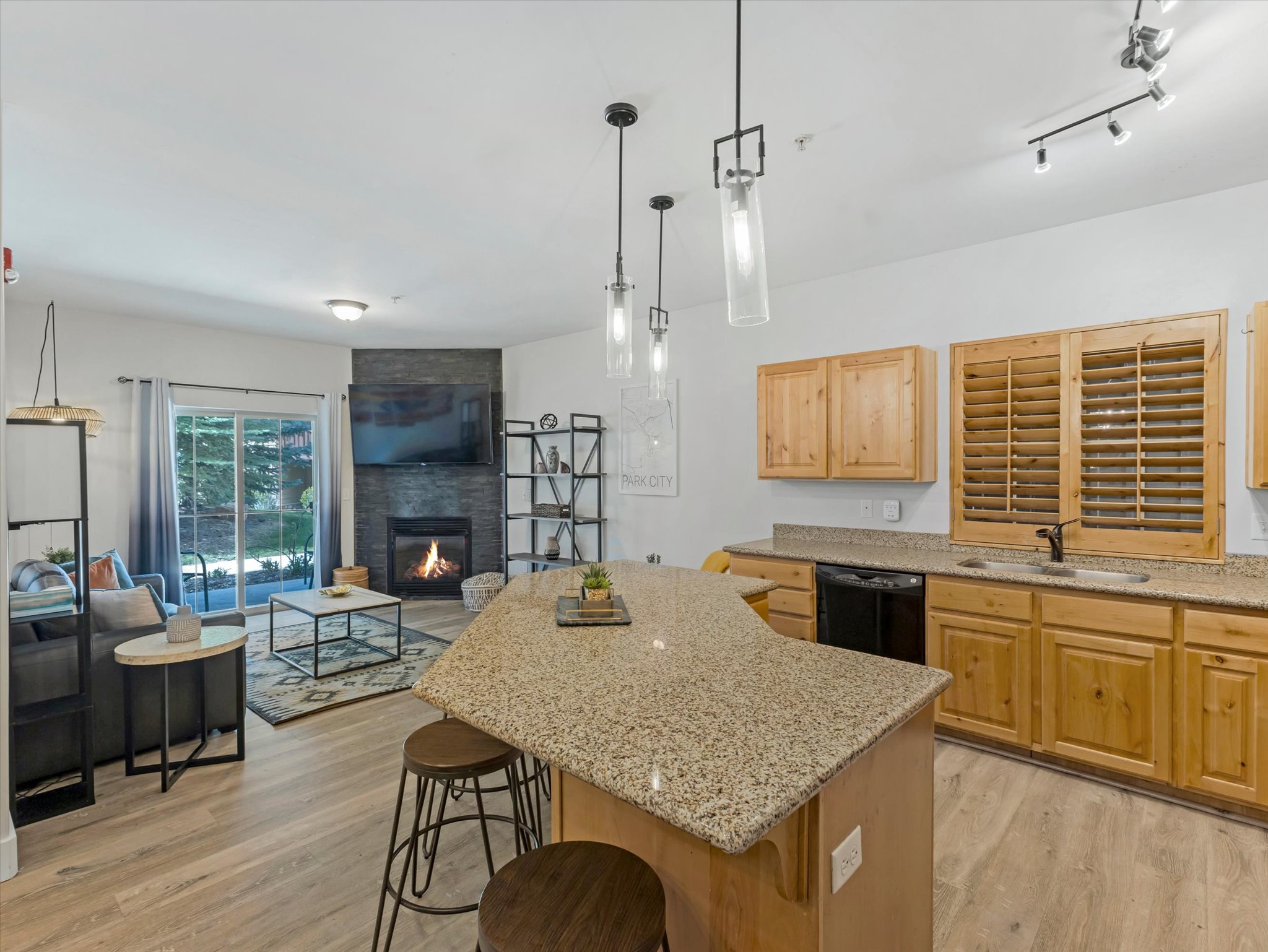 Kitchen island with a granite-style countertop and seating