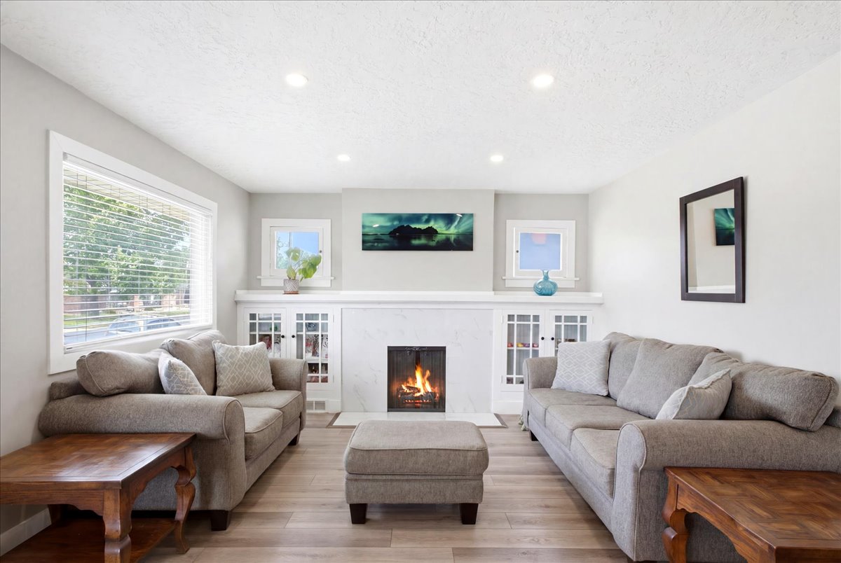 Fresh paint, laminate flooring, recessed lighting and fireplace.