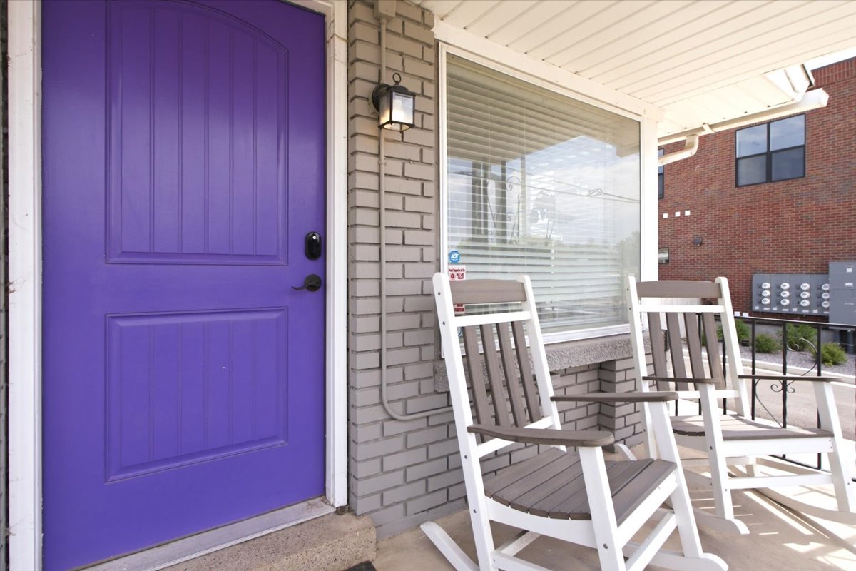 The charming covered front porch provides another perfect spot to relax and enjoy the neighborhood.