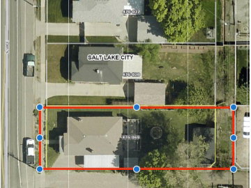 Alley/trailer parking behind garage is included in the parcel.