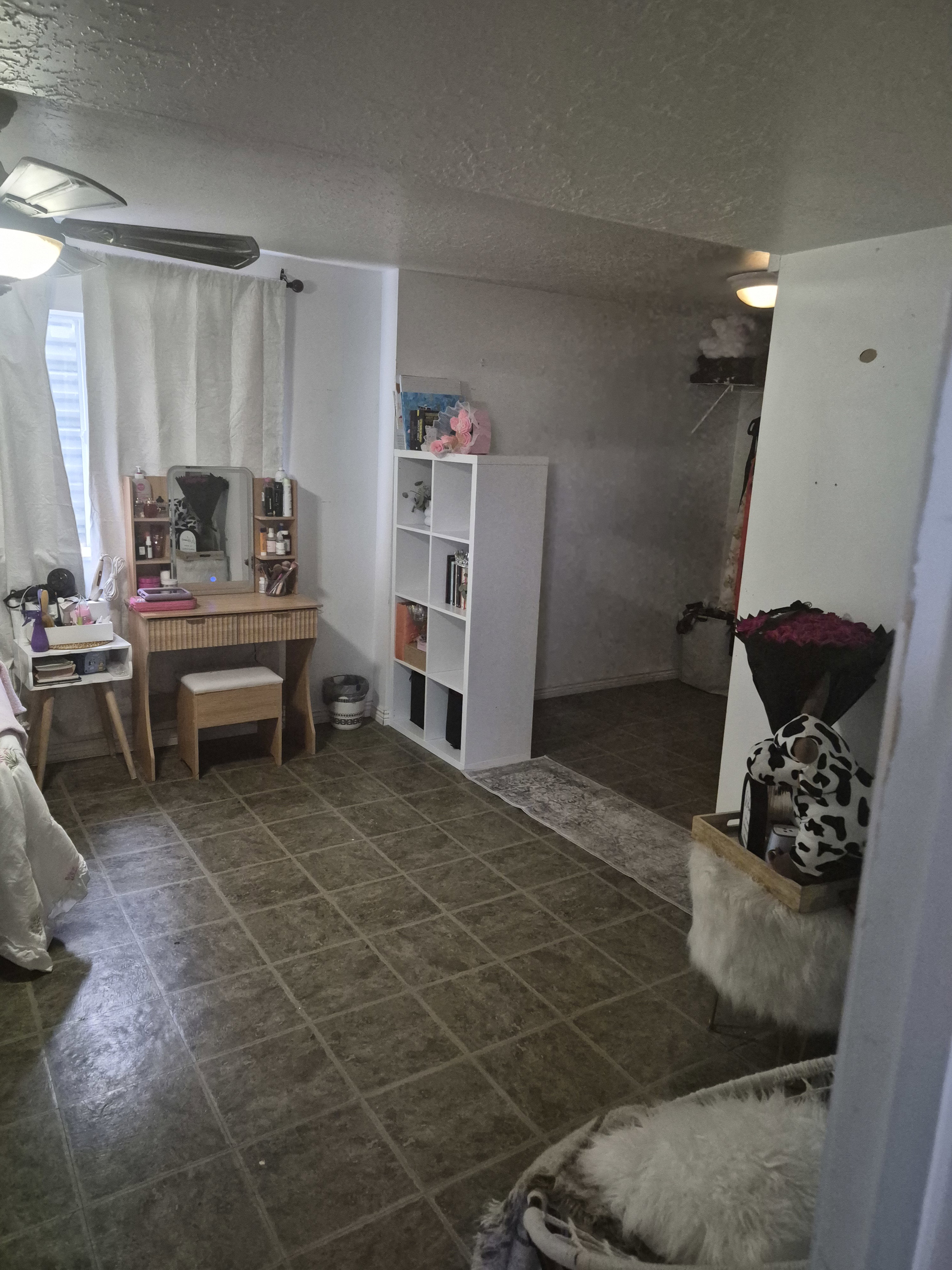 Interior space featuring grid-patterned floor tiling