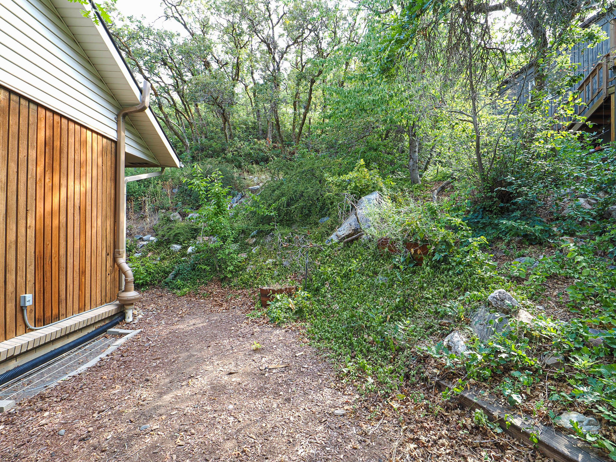 Wood-finish vertical siding with light-colored horizontal siding