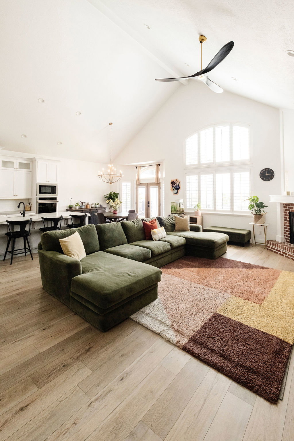 Vaulted ceiling great room with wood-finish flooring