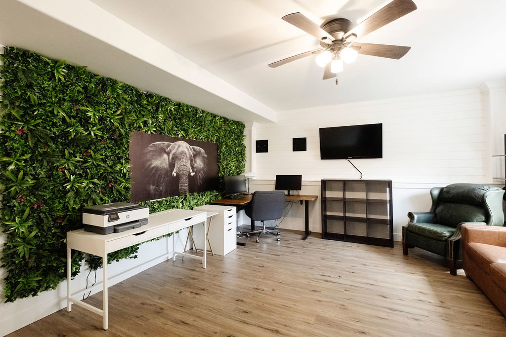 Accent wall featuring artificial greenery