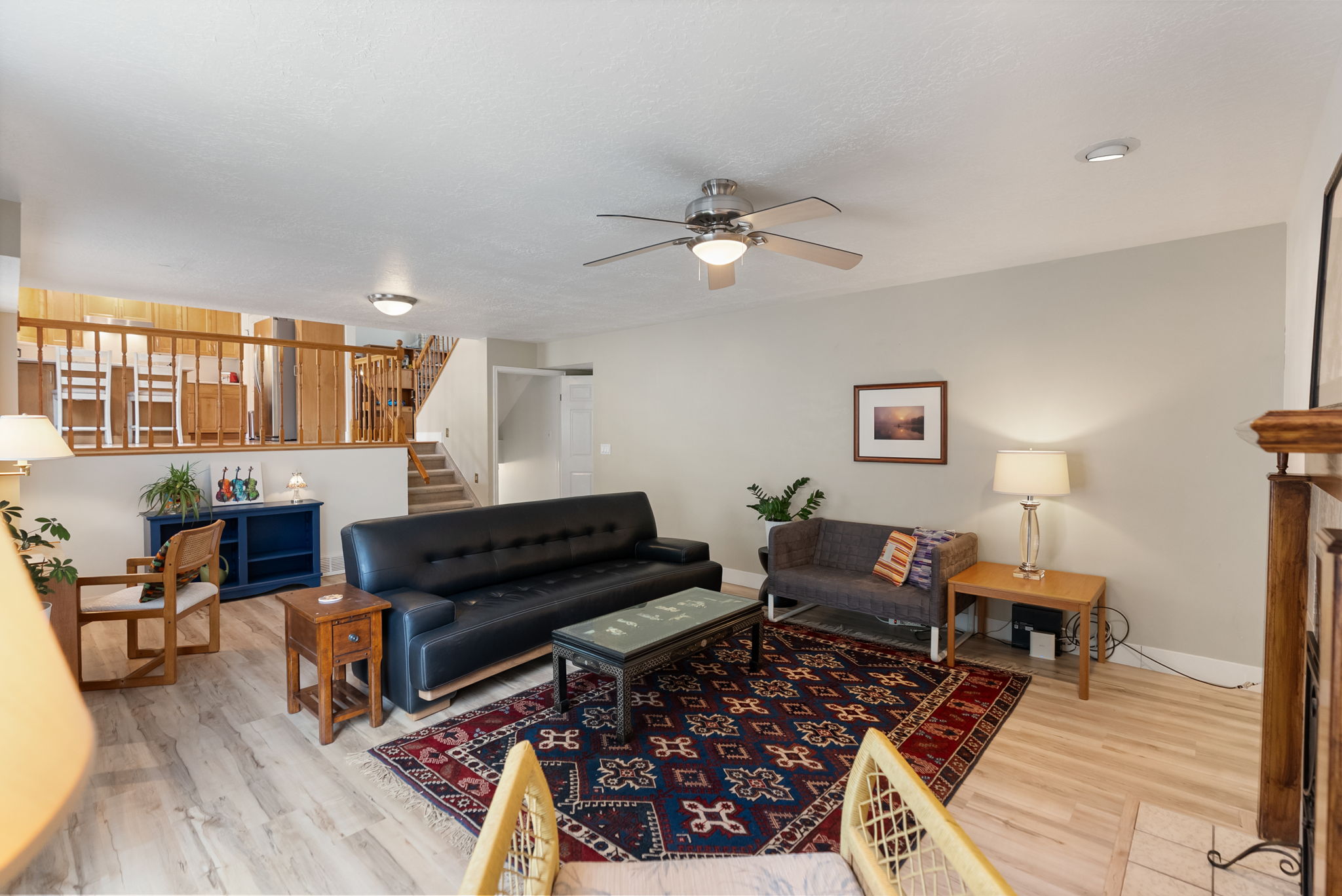 Open concept living area featuring light wood-finish flooring and neutral wall tones