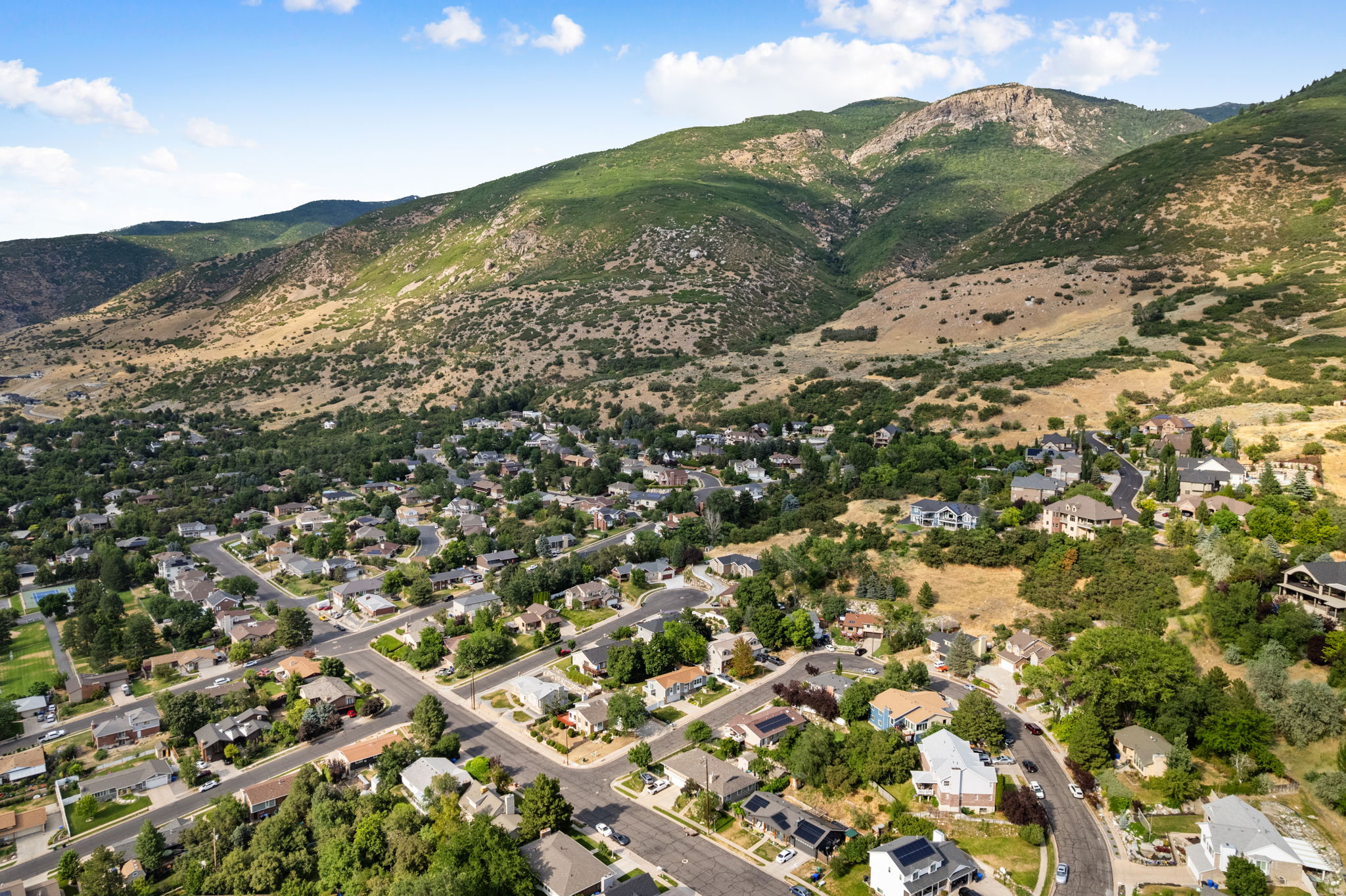 Expansive mountain backdrop framing a residential community