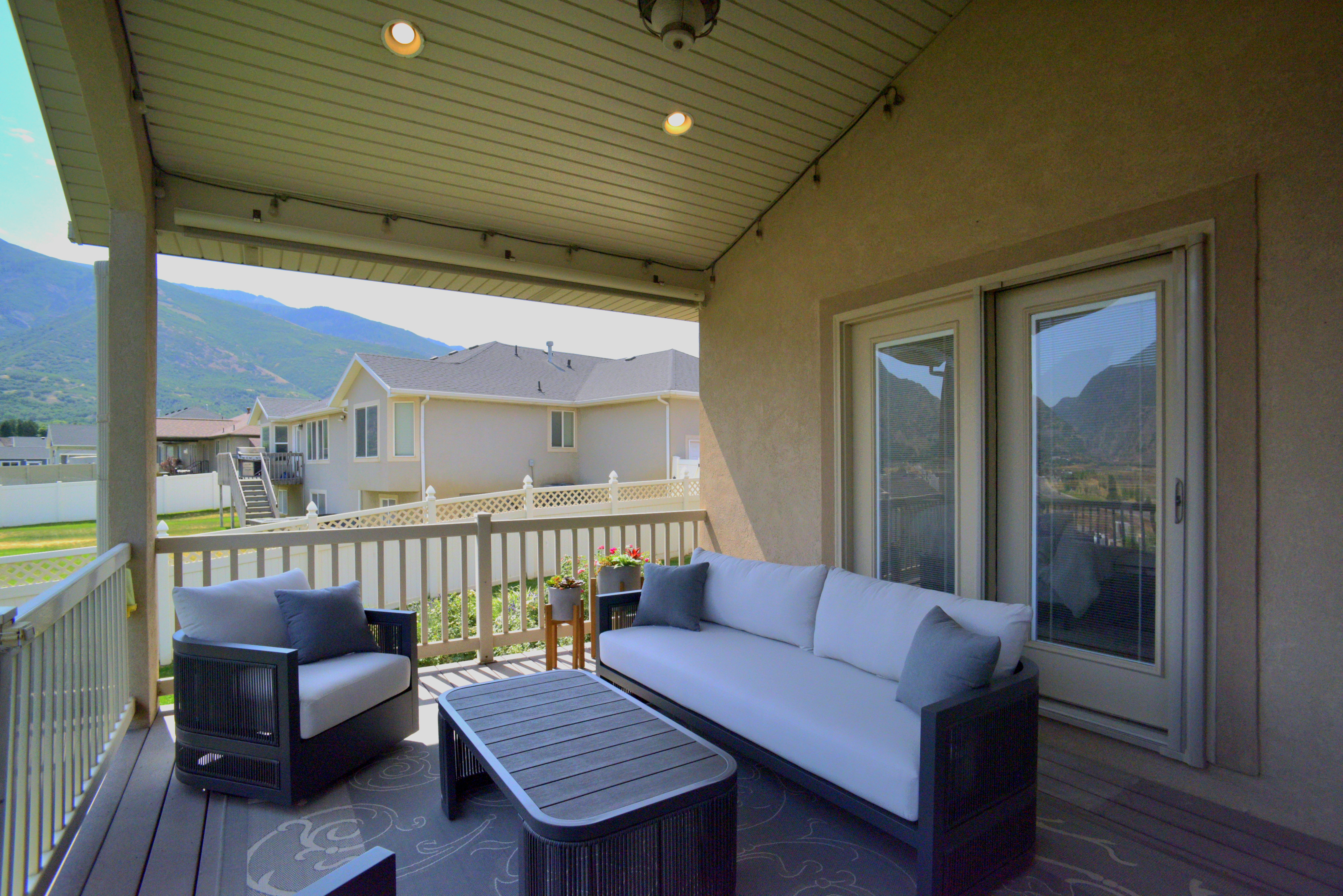 LOVELY COVERED PATIO WITH EDISON LIGHTS TO ENJOY YOUR BEAUTIFUL EVENING VIEWS!
