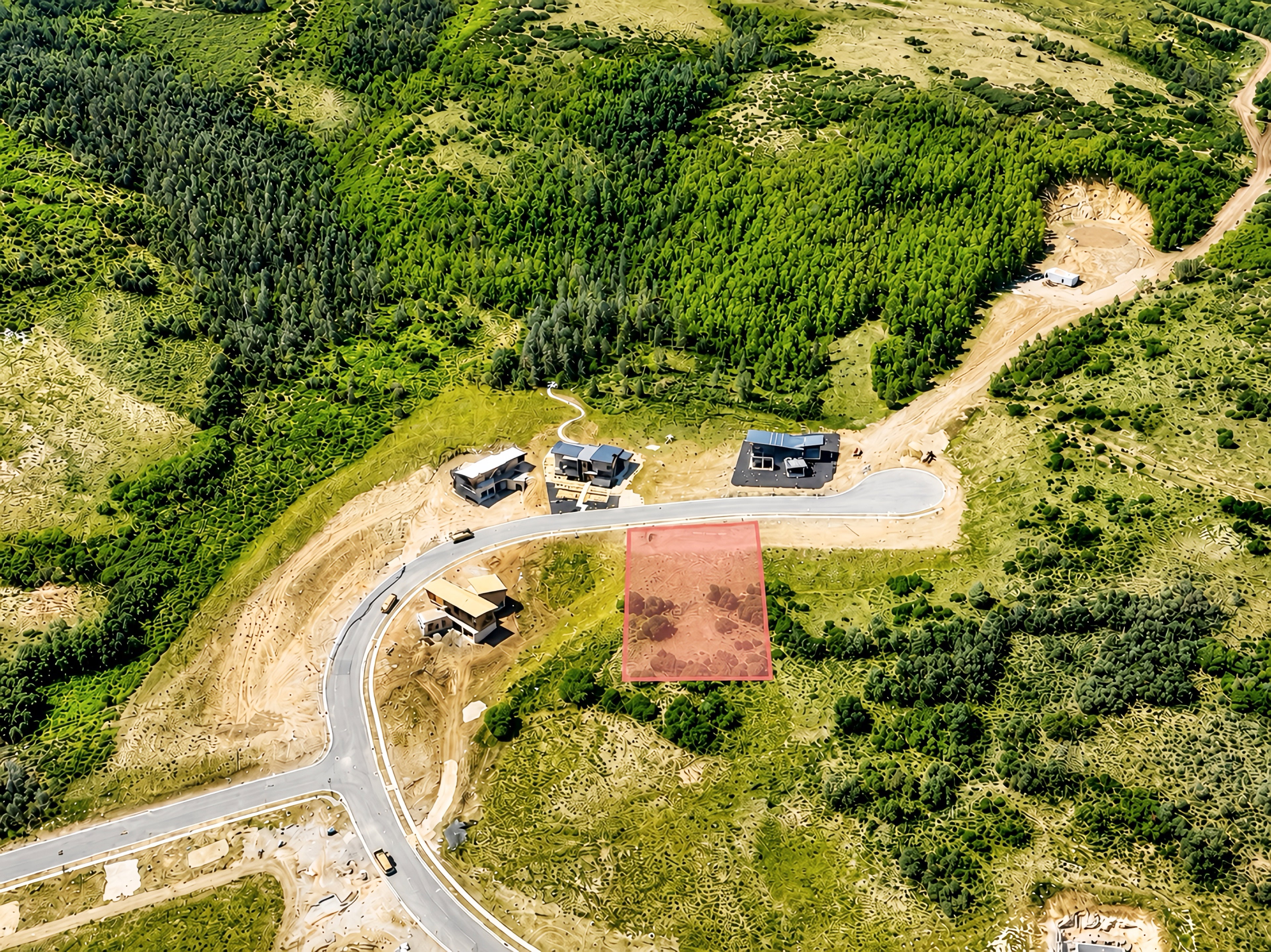 Aerial perspective showcasing a parcel of land marked in red, surrounded by lush green foliage and scattered trees