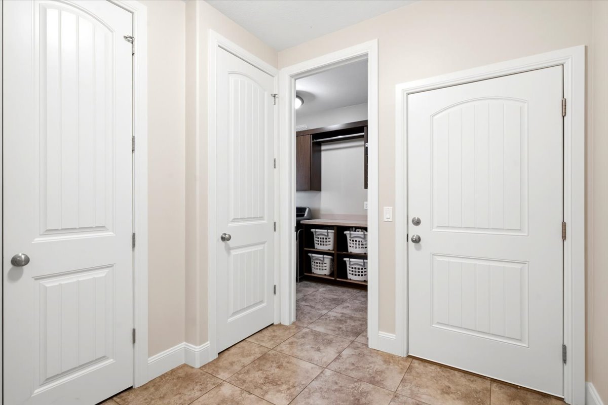 Entryway featuring neutral wall paint and tile flooring