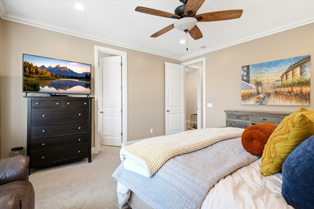 Recessed lighting, crown molding, and a ceiling fan with light fixture