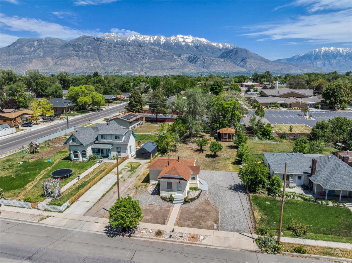 Aerial perspective showcasing the property with a mountainous backdrop