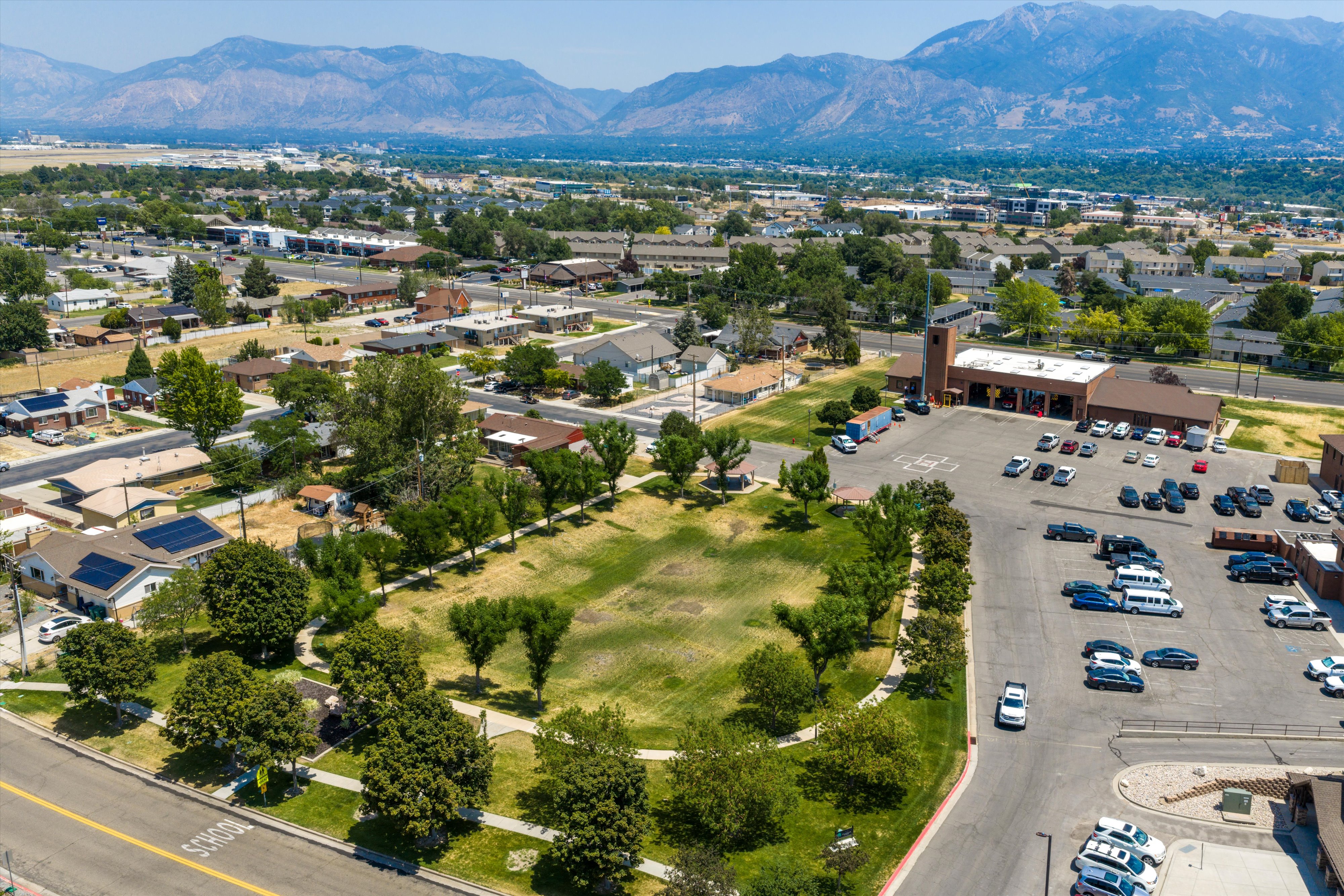 Aerial perspective showcasing a residential neighborhood with distant mountains