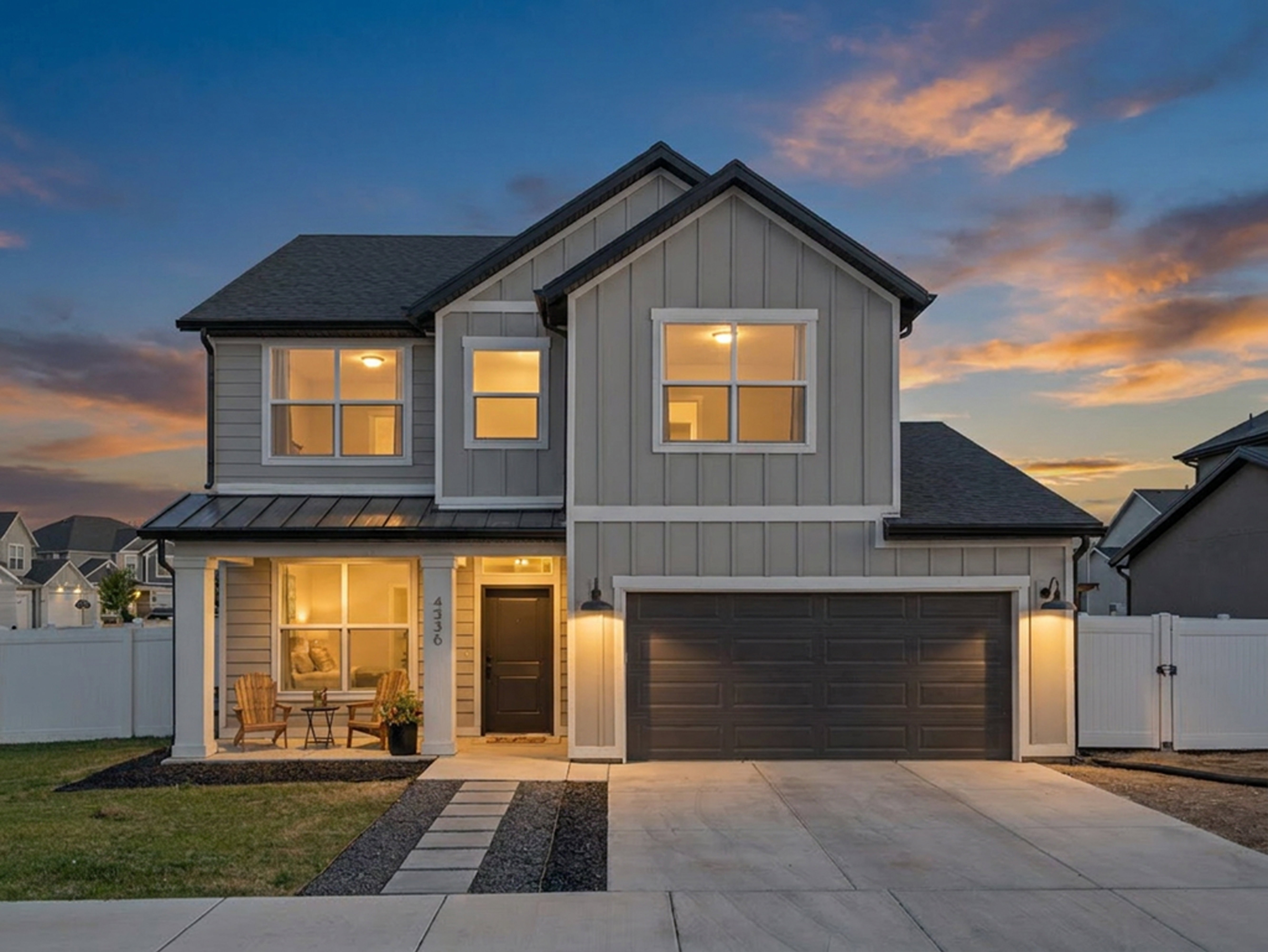 Contemporary two-story exterior featuring board and batten siding and a covered front porch
