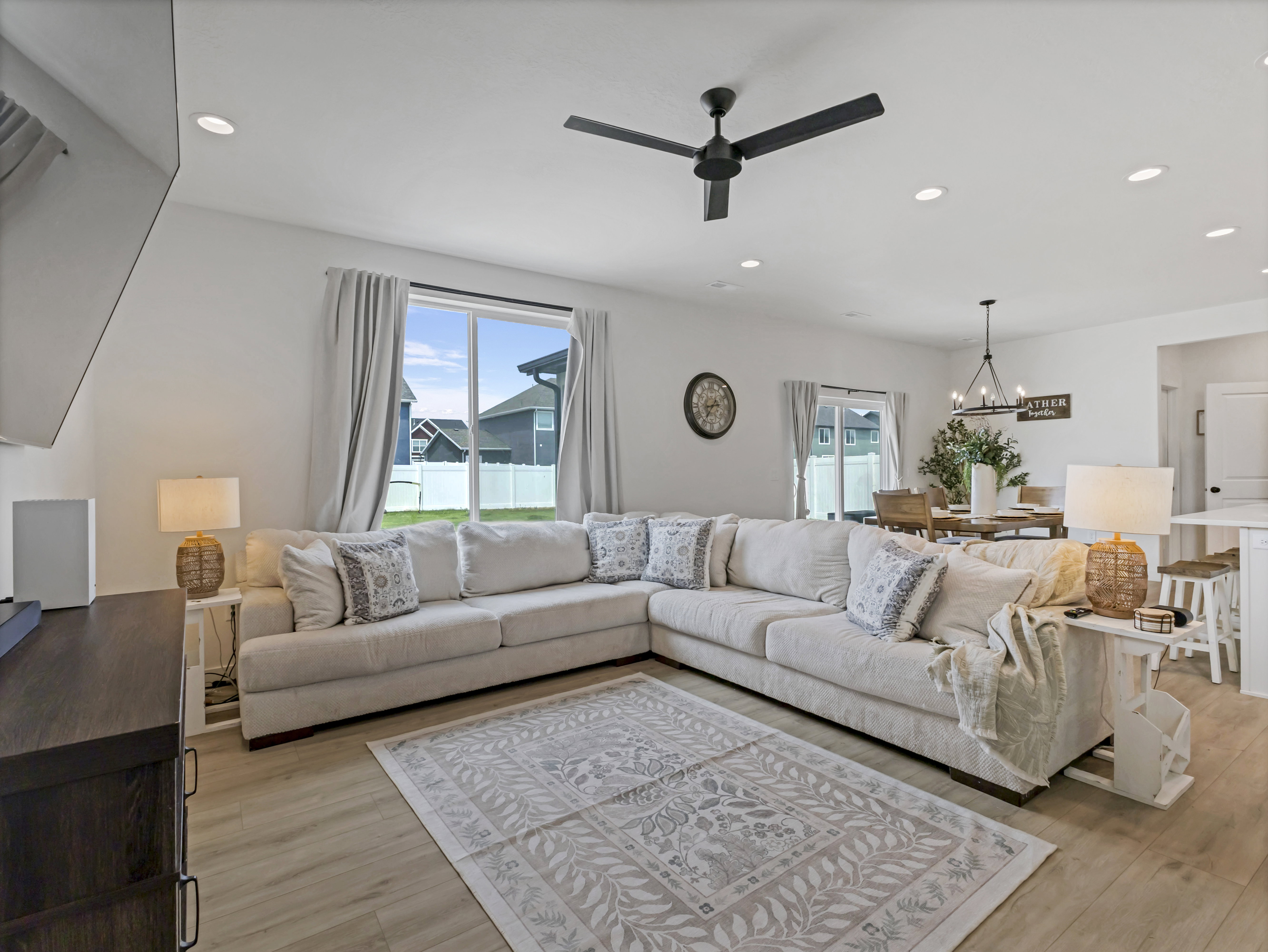 Bright living area with light wood-finish flooring