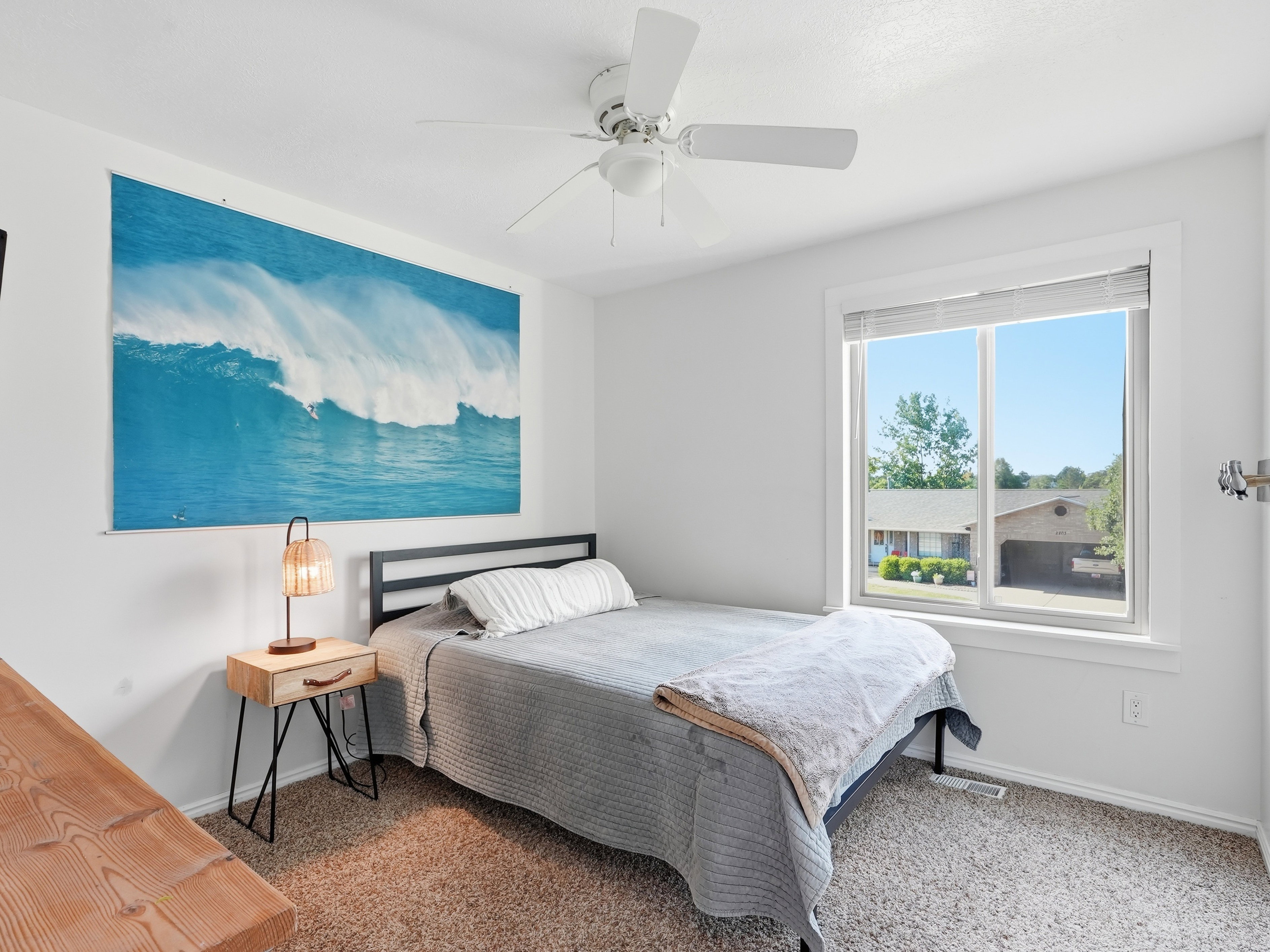 Bedroom featuring a window with blinds, a ceiling fan, and carpet flooring
