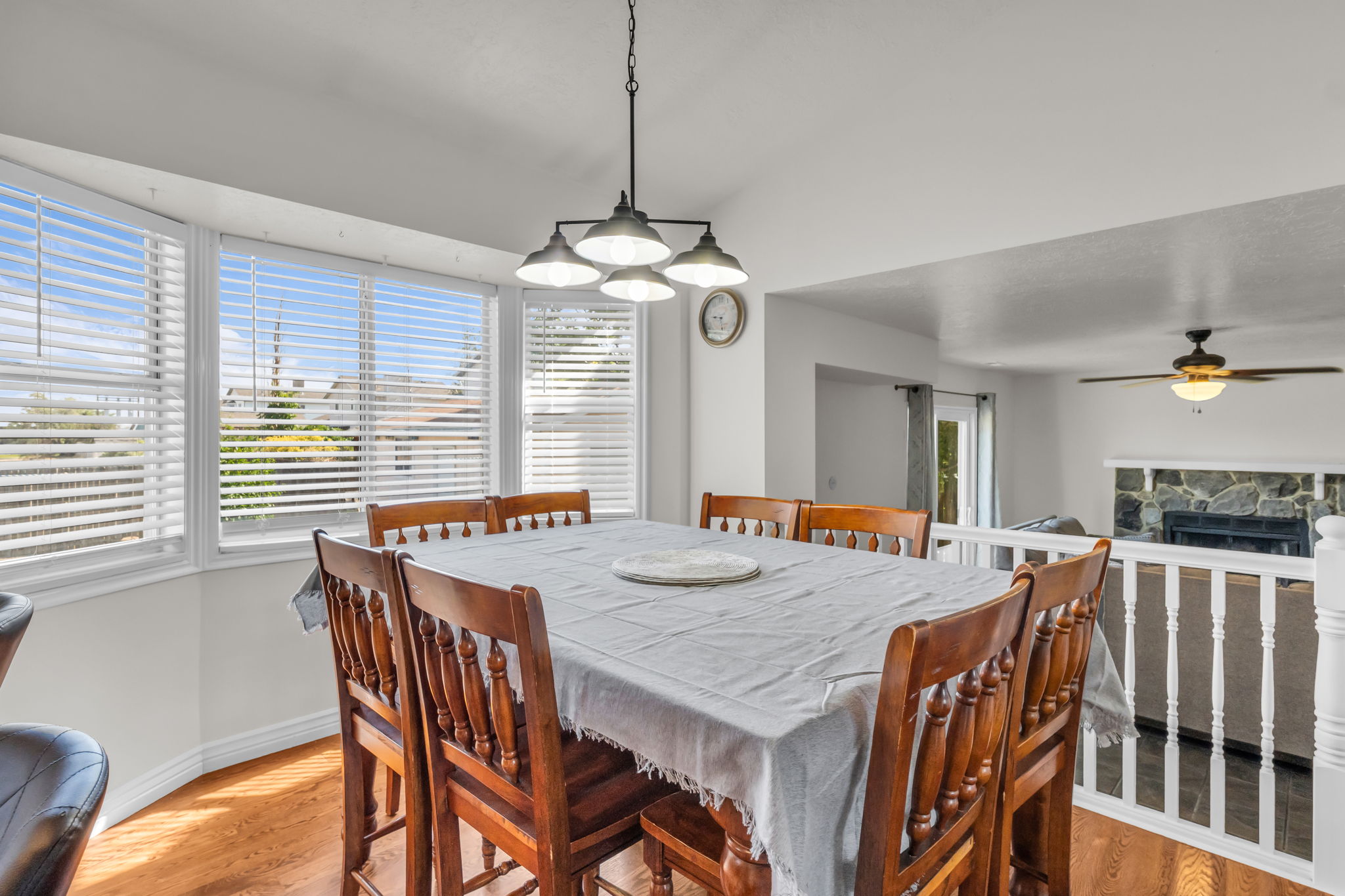 Dining area featuring wood-finish flooring and a multi-panel bay window