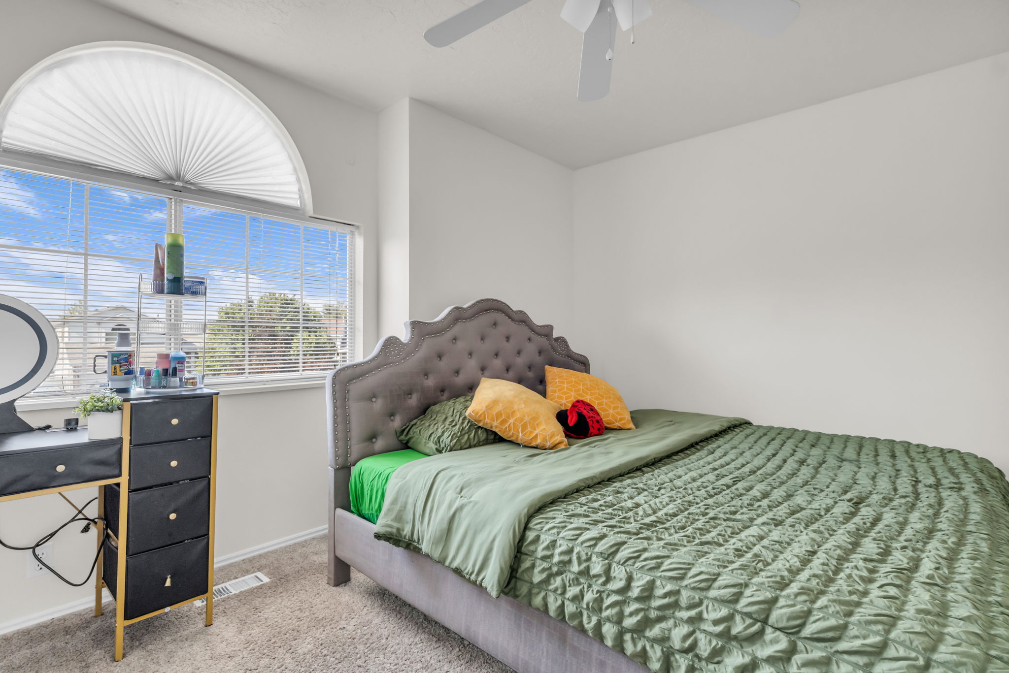 Arch-top window with horizontal blinds and an integrated cellular shade