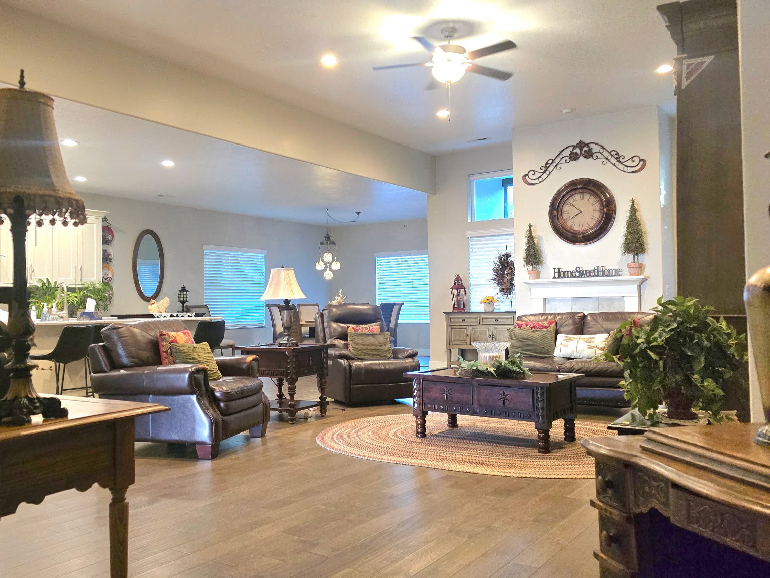 Expansive living area featuring wood-finish flooring, recessed lighting, and a ceiling fan