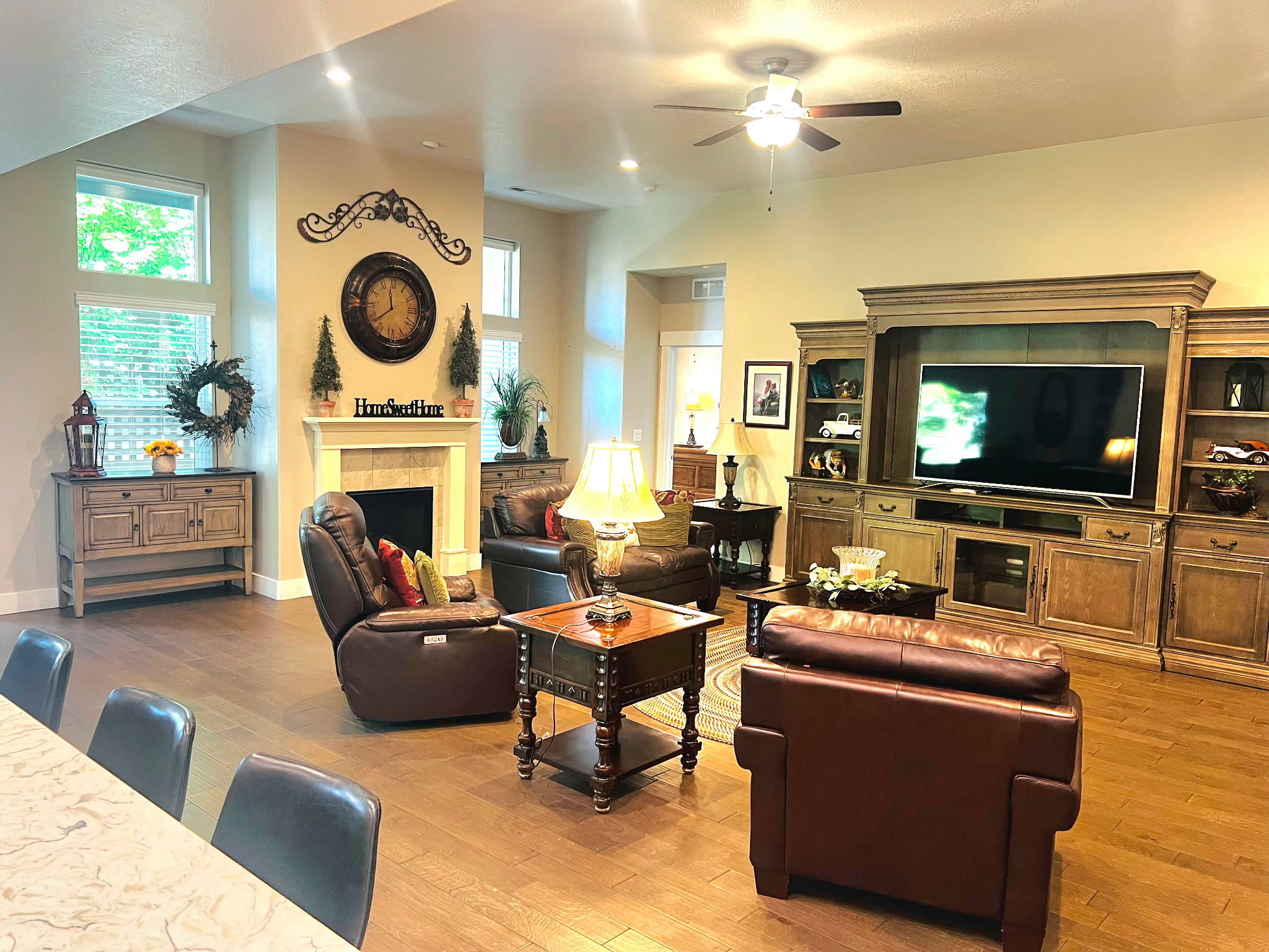 Living area with wood-finish flooring and vaulted ceilings