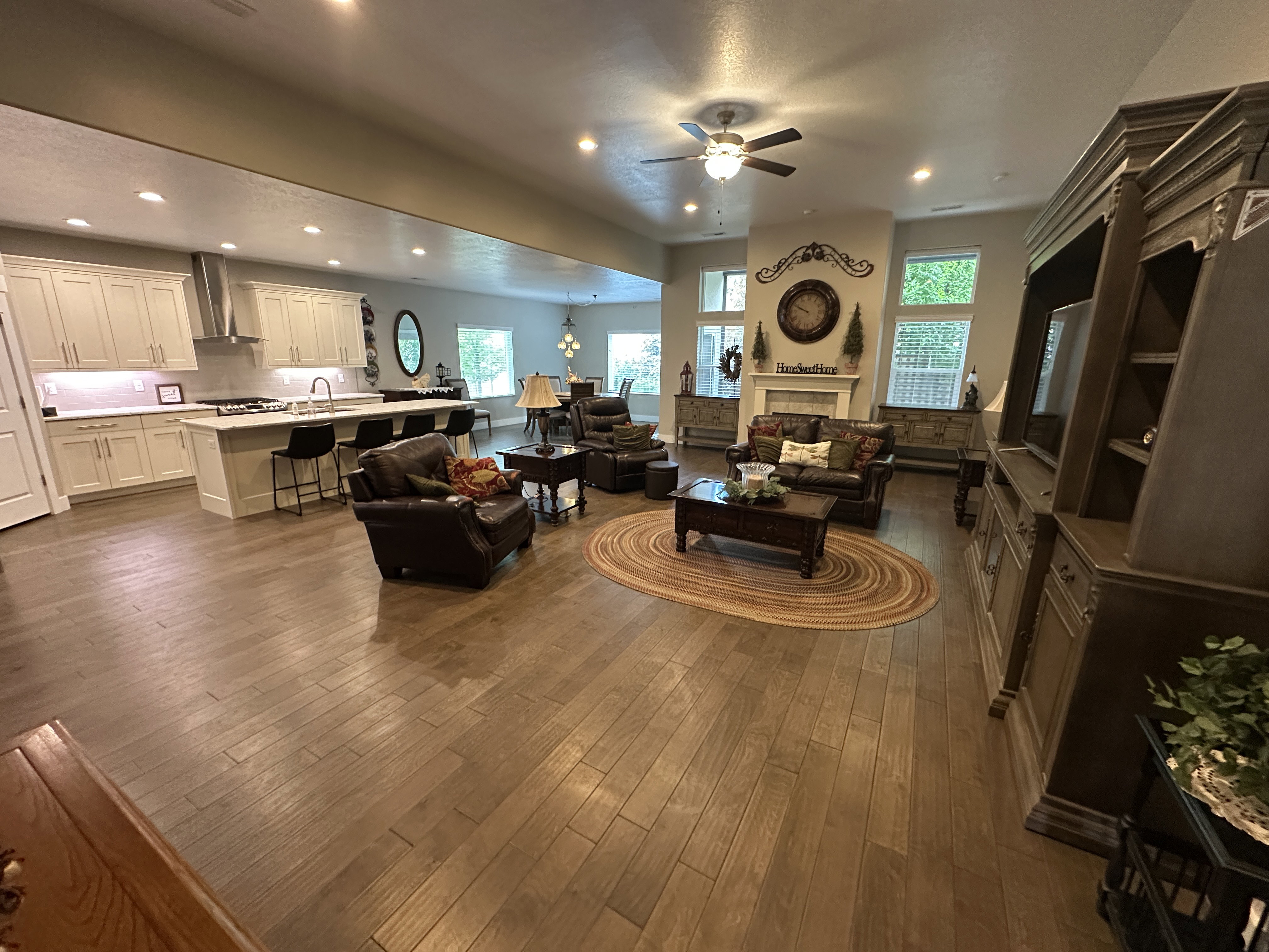Spacious open-concept interior featuring wood-finish flooring throughout