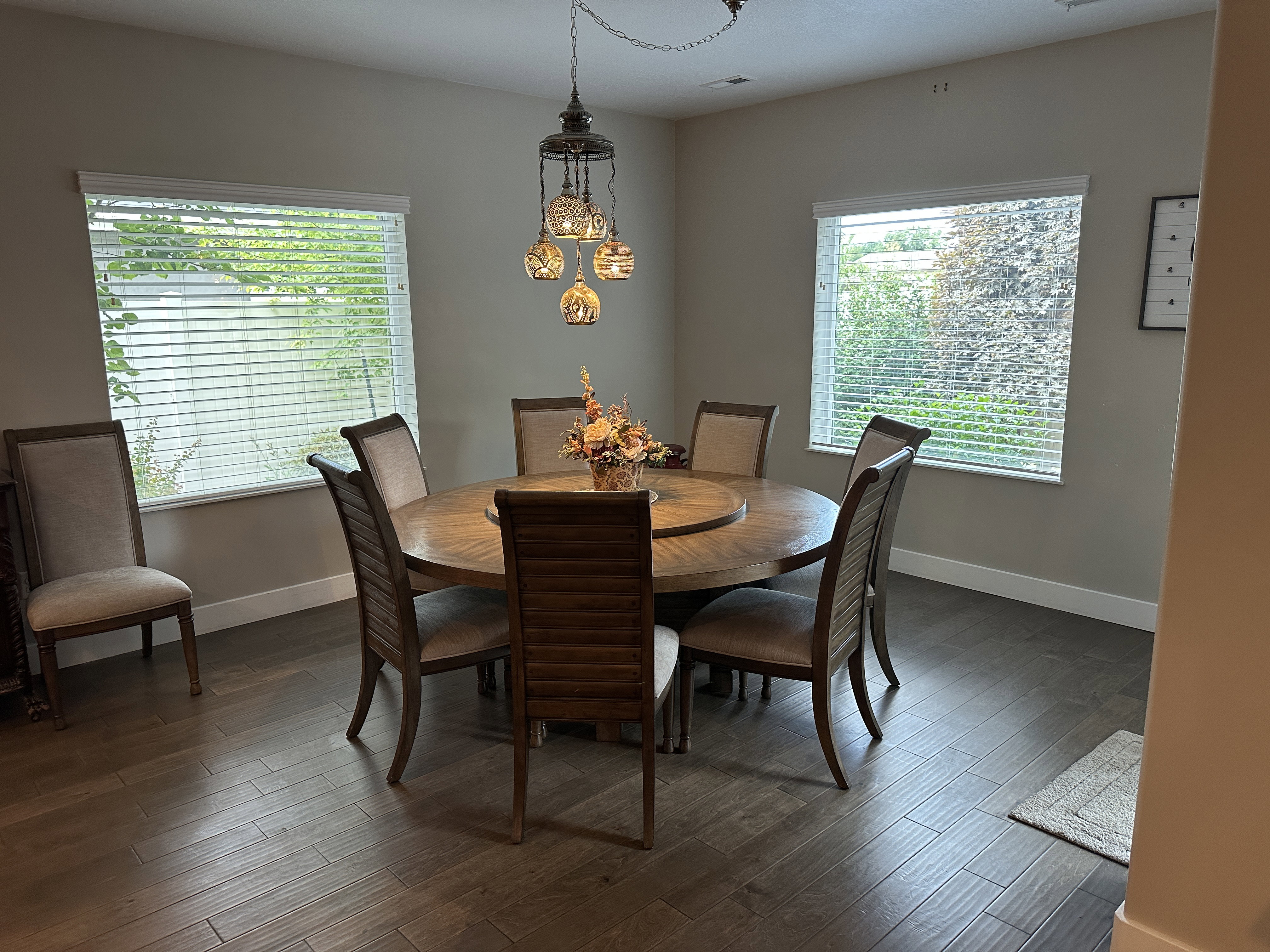 Formal dining area featuring wood-finish flooring