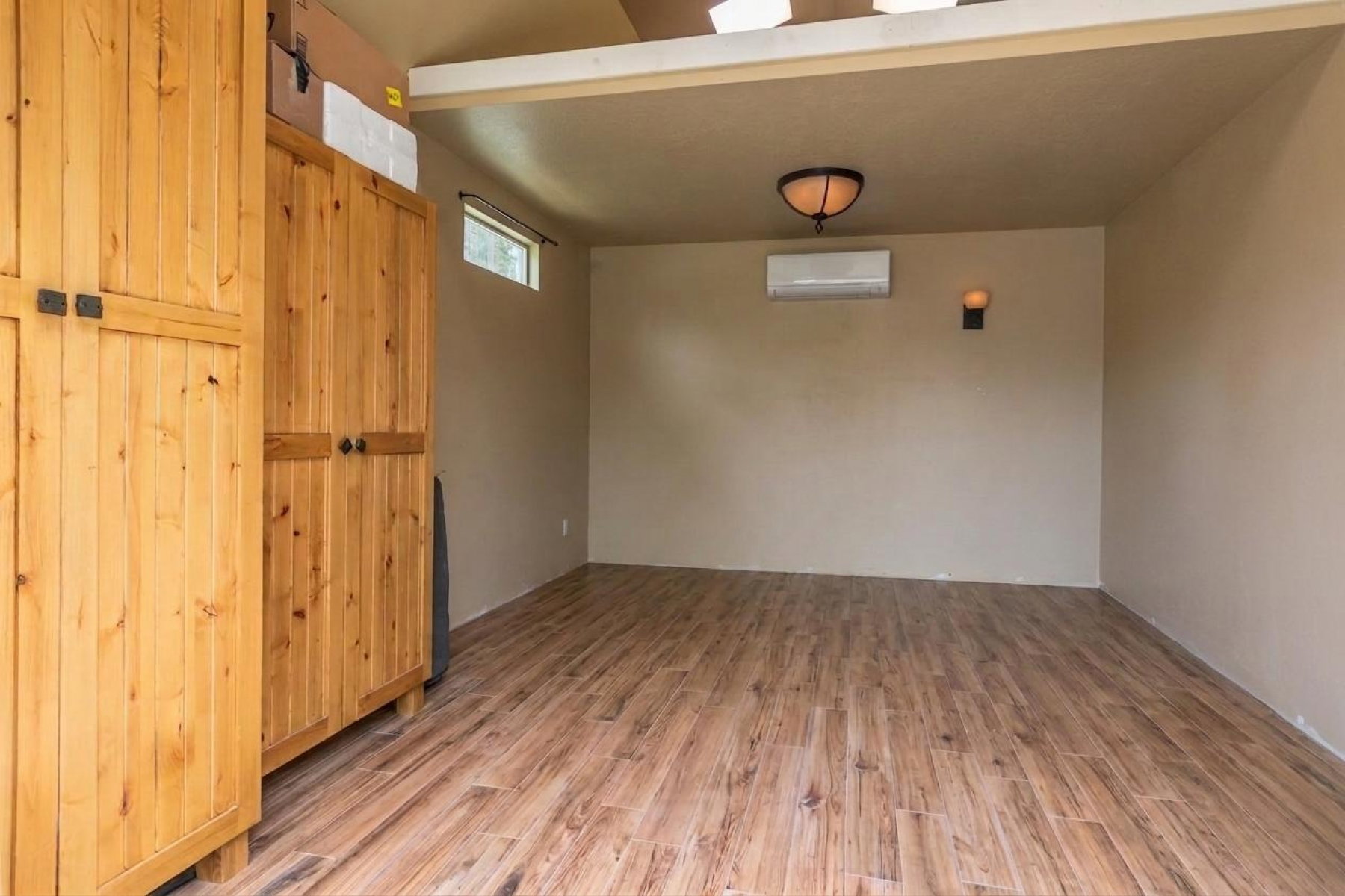 Bonus Room w/ heater & AC, beautiful cabinets & flooring and extra storage above