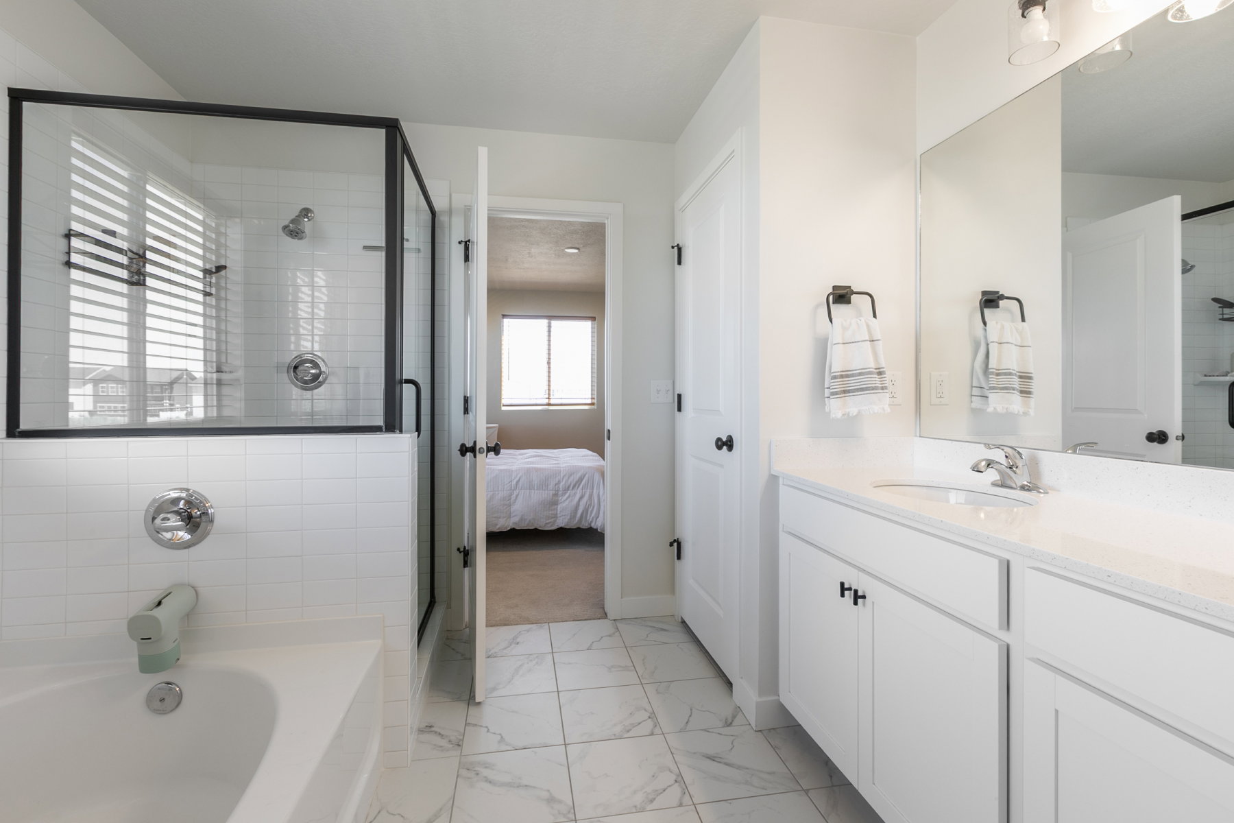 Primary bathroom upgrades include euro glass shower, upgraded fixtures.