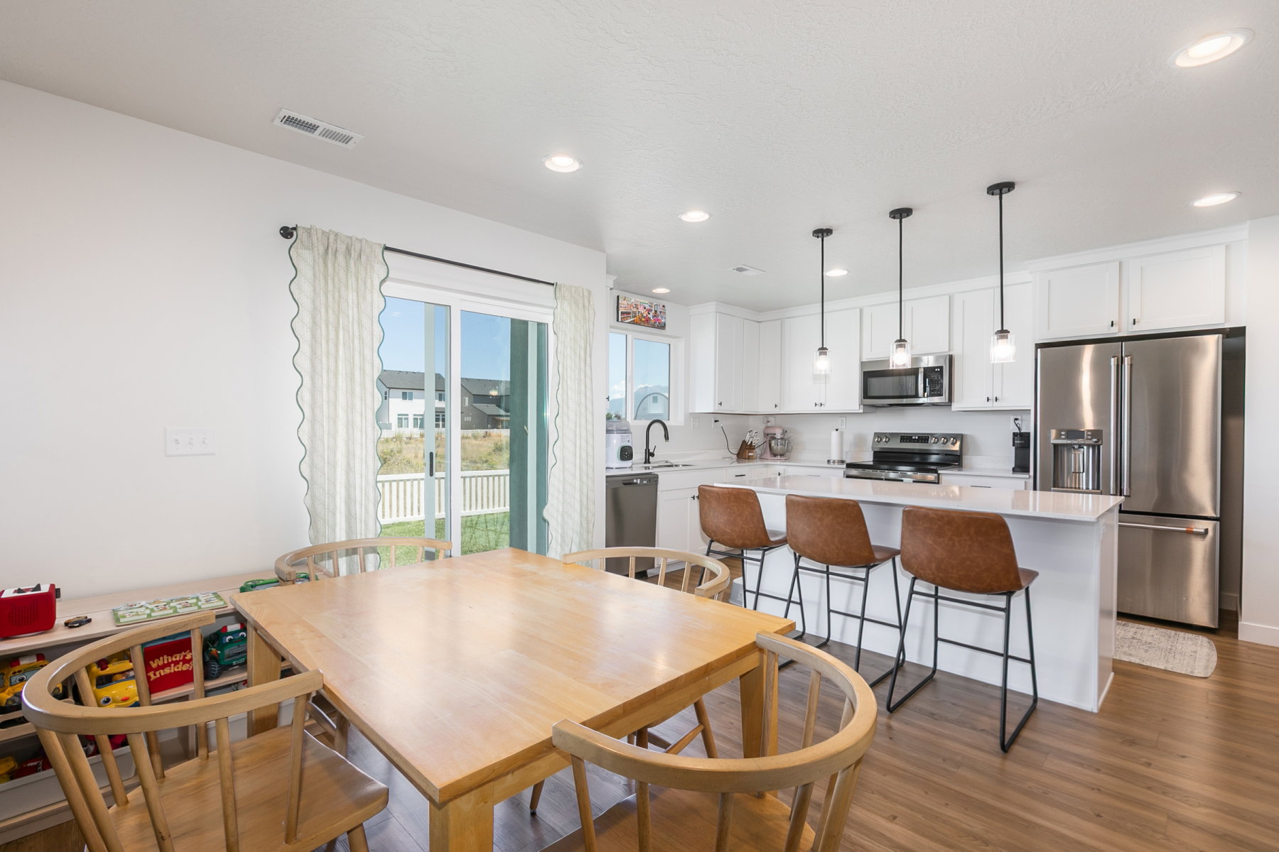 Kitchen upgrades include: 42" cabinets, lighting, VoiceIQ faucet, quartz counter tops, gas line for stove. Refrigerator included.
