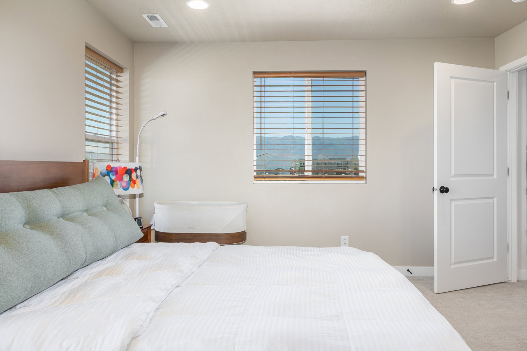 Primary bedroom with beautiful east views of mountains.