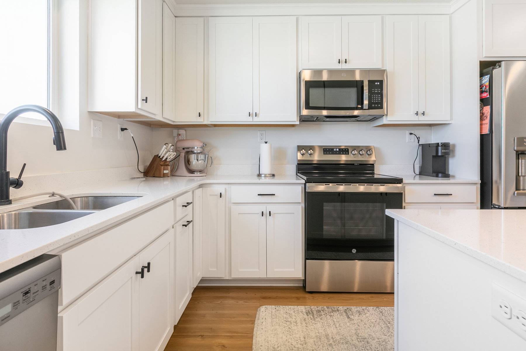 Kitchen upgrades include: 42" cabinets, lighting, VoiceIQ faucet, quartz counter tops, gas line for stove. Refrigerator included.